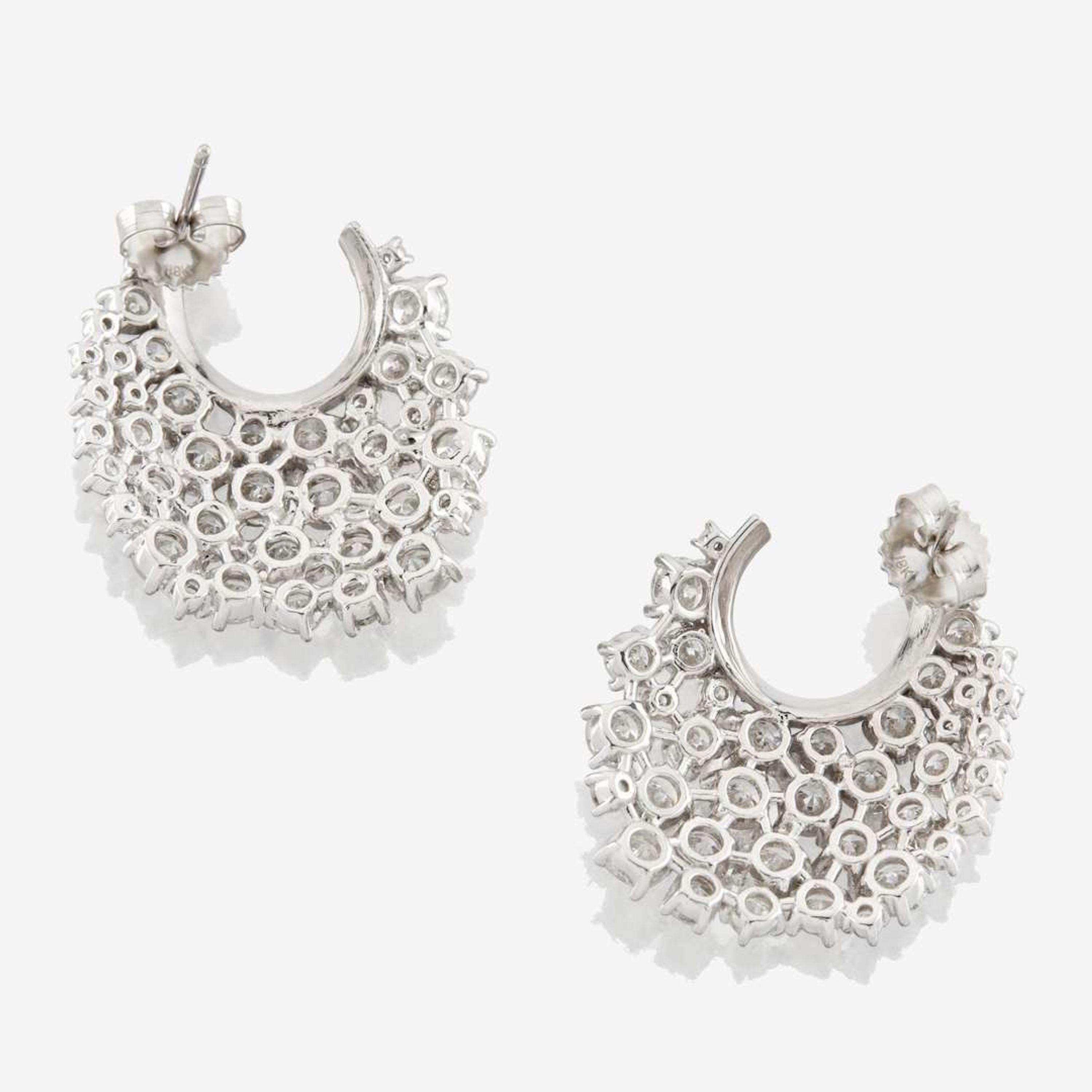 A pair of diamond and white gold earrings