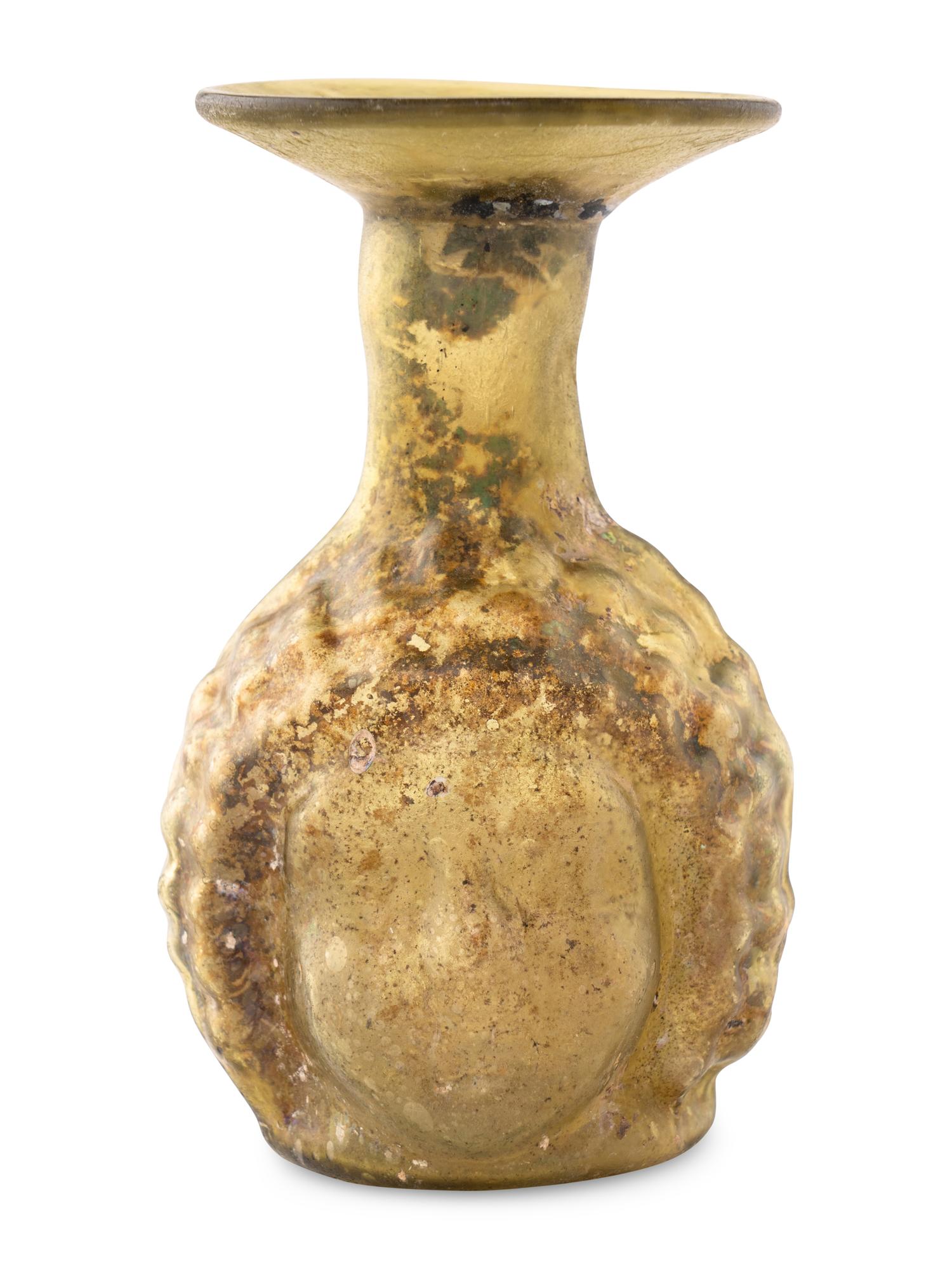 A Roman Glass Janus Head Flask