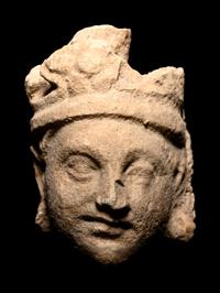 Three Gandharan Fragmentary Stucco Heads and One European Fragmentary Stucco Head