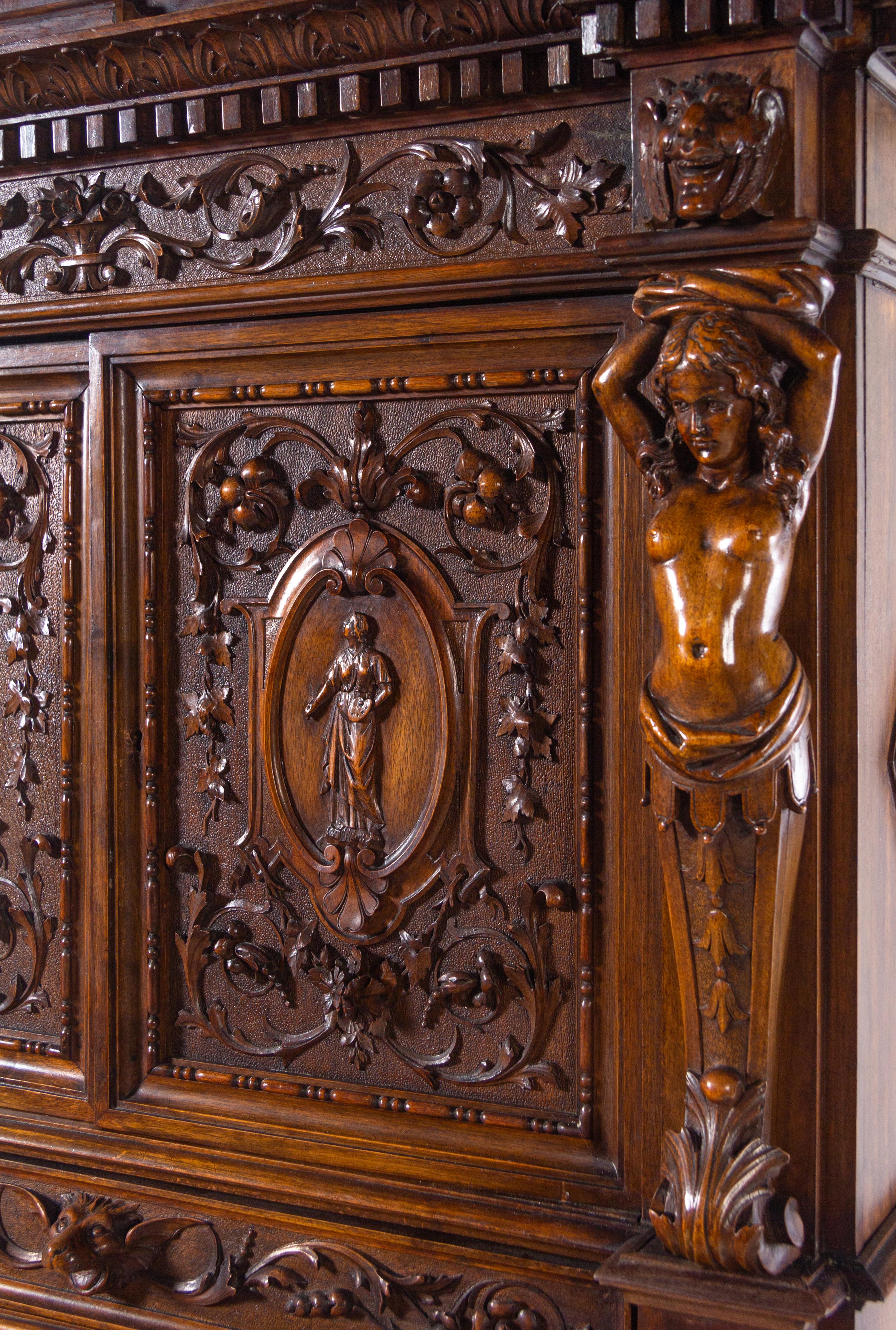 A Renaissance Revival Carved Walnut Cabinet on Stand