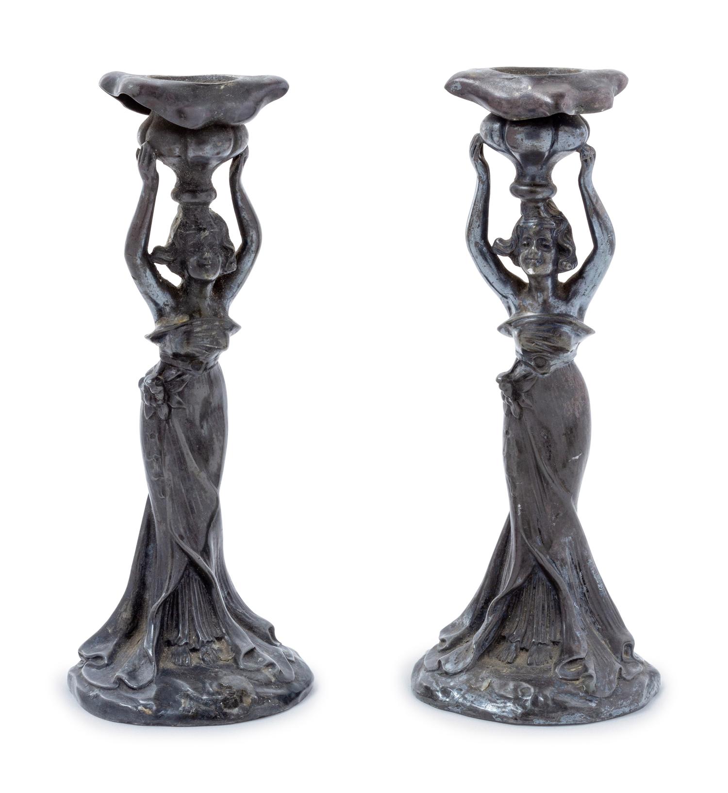 A Pair of Art Nouveau Cast Metal Figural Candlesticks