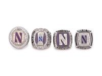 A Group of Four Northwestern University Football and Basketball Championship Rings,