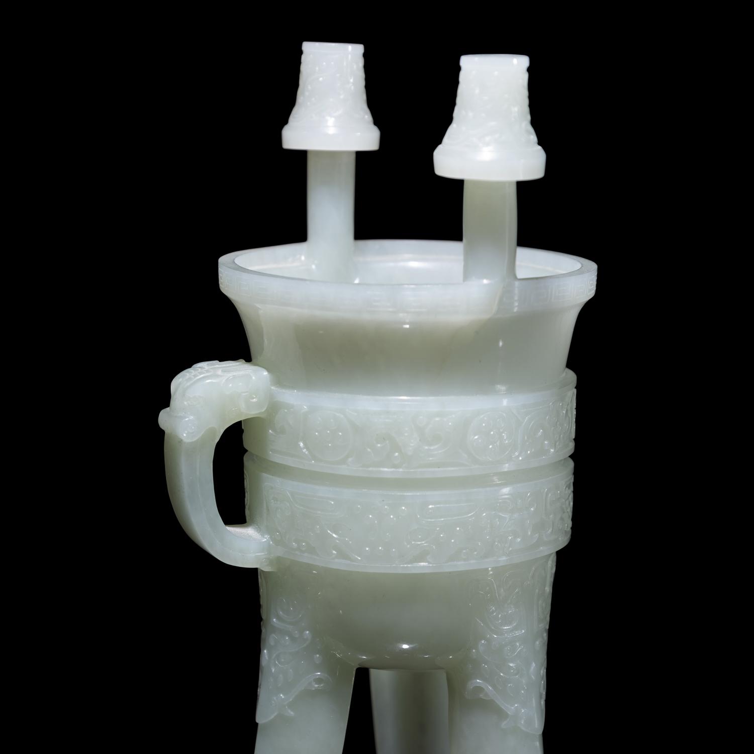A Chinese Carved Pale Celadon Jade Tripod Vessel, Jia, Late Qing - Early Republic Period 晚清/民國 青白玉仿古斝