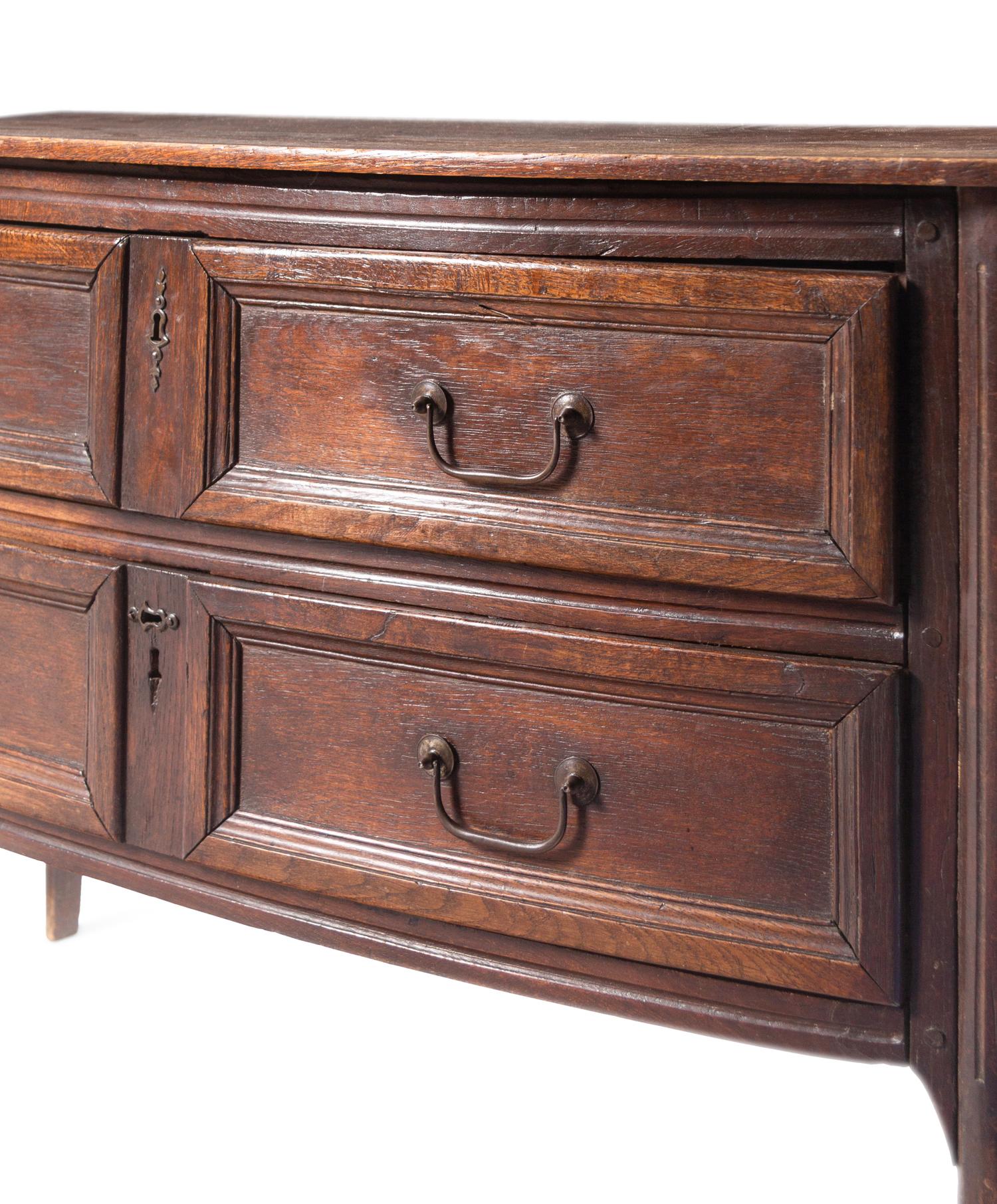An Italian Oak Bow-Front Chest of Drawers