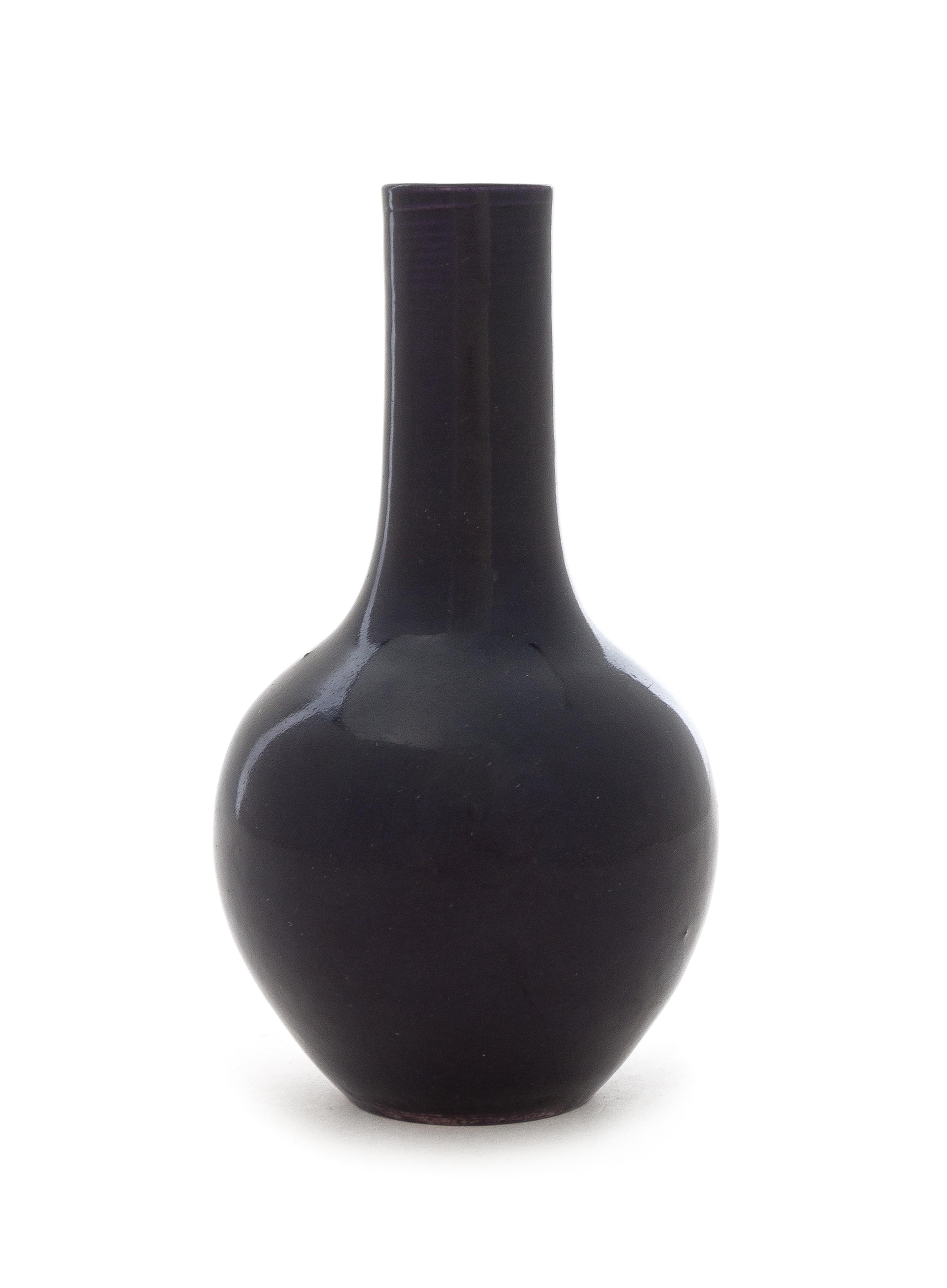 A Chinese Dark Aubergine Glazed Porcelain Bottle Vase Height 5 1/2 inches. — 19TH CENTURY