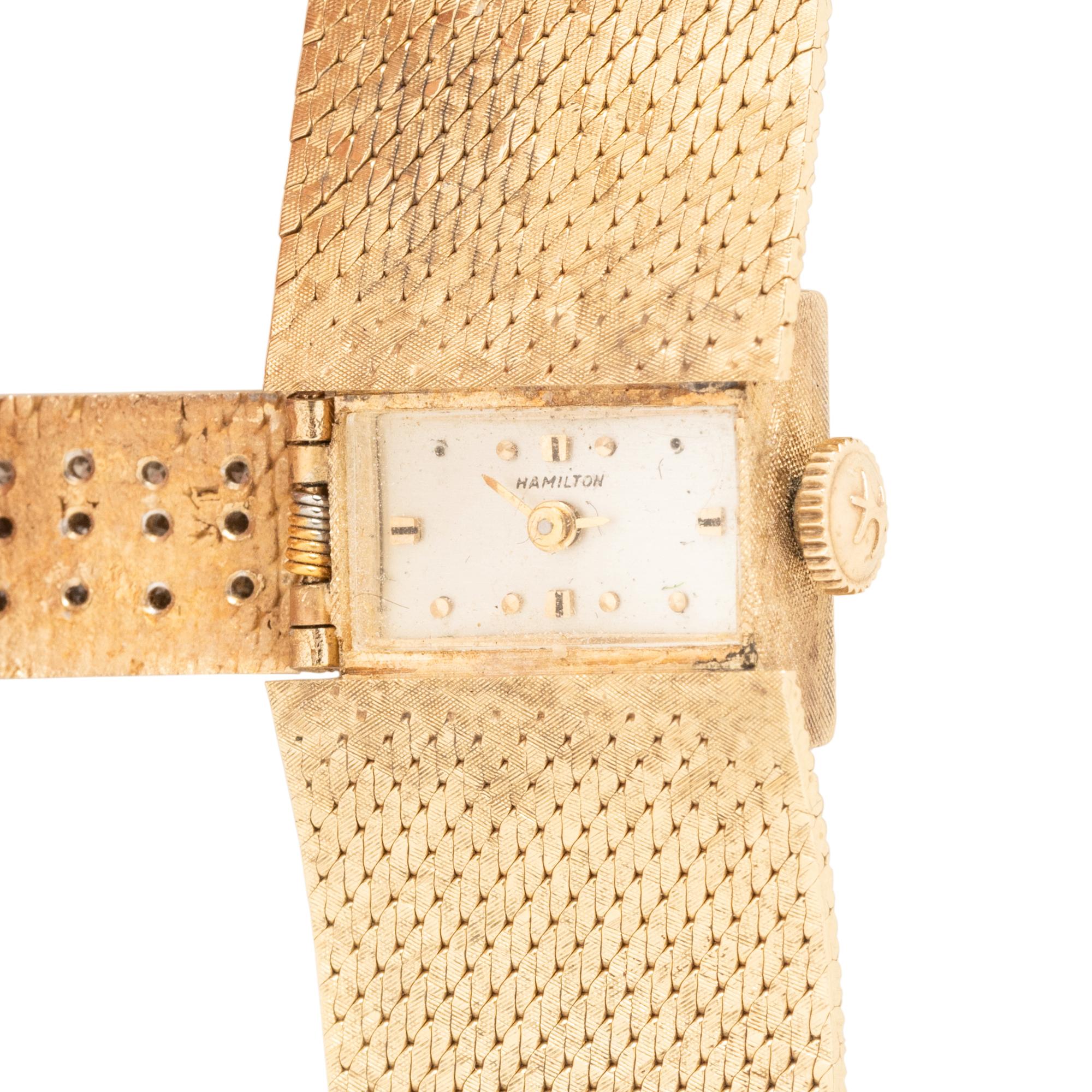 HAMILTON, YELLOW GOLD AND DIAMOND HIDDEN DIAL WATCH