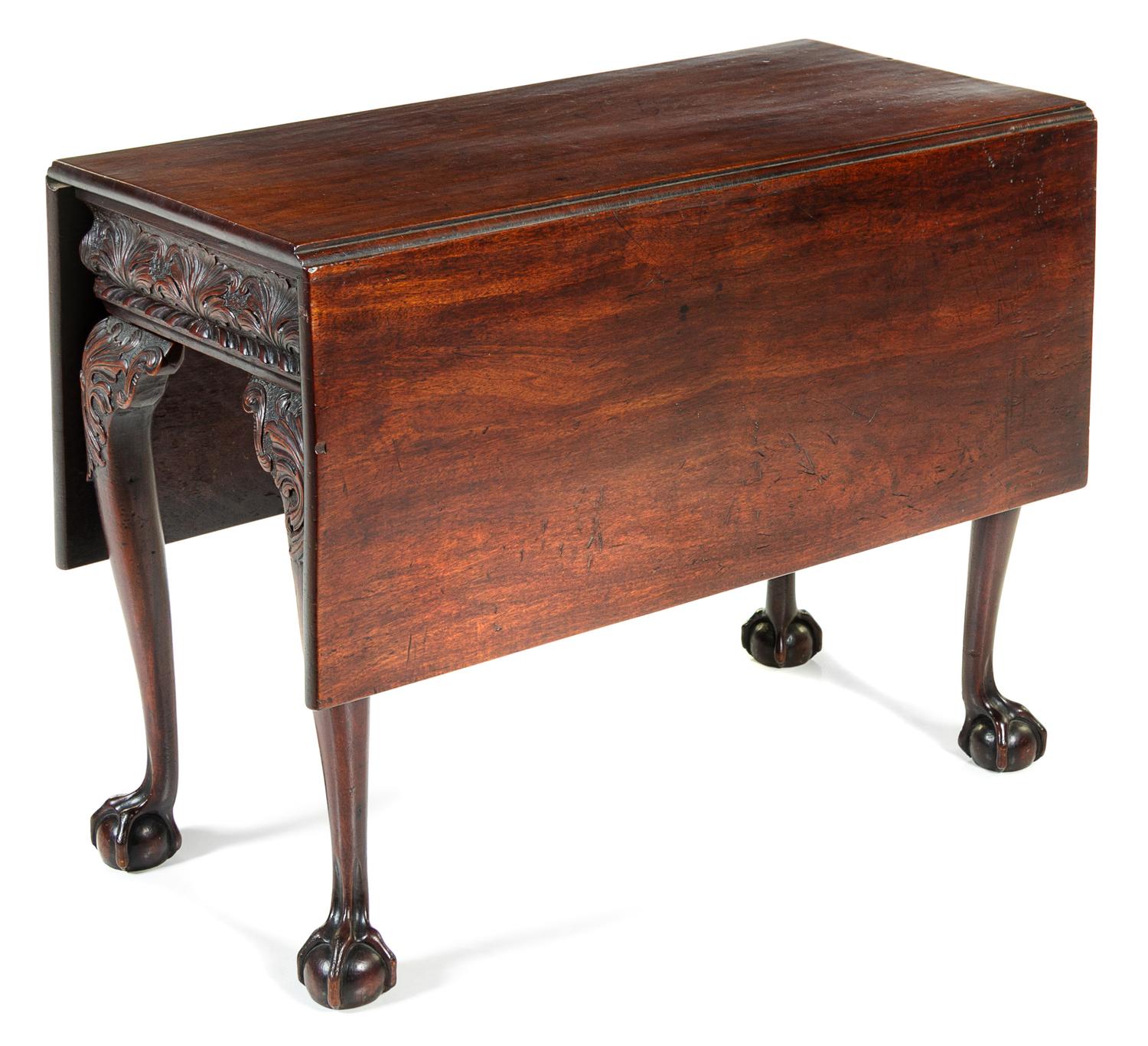 A George II Mahogany Drop-Leaf Table Height 28 x width 36 1/2 x depth 18 inches (closed). — PROBABLY IRISH, 18TH CENTURY