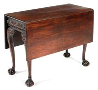A George II Mahogany Drop-Leaf Table Height 28 x width 36 1/2 x depth 18 inches (closed). — PROBABLY IRISH, 18TH CENTURY