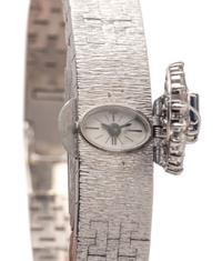 PIAGET, 18K WHITE GOLD, DIAMOND AND SAPPHIRE SURPRISE WATCH