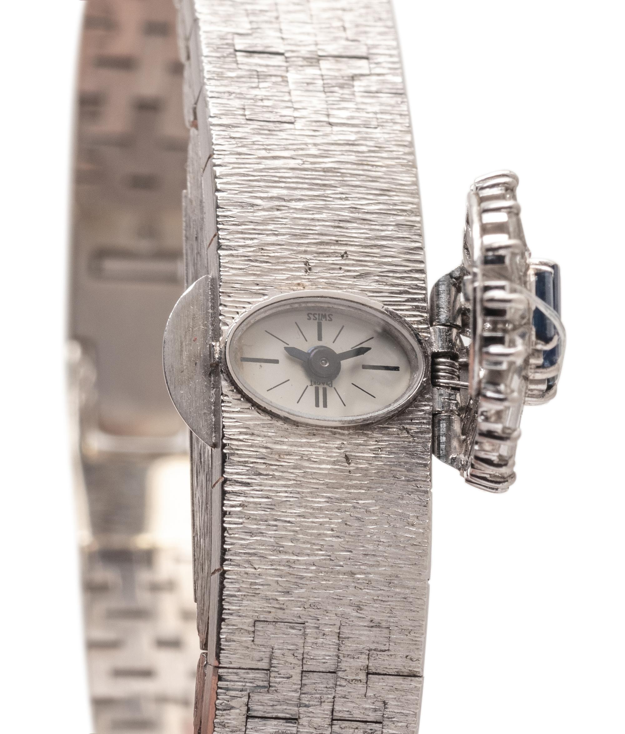 PIAGET, 18K WHITE GOLD, DIAMOND AND SAPPHIRE SURPRISE WATCH