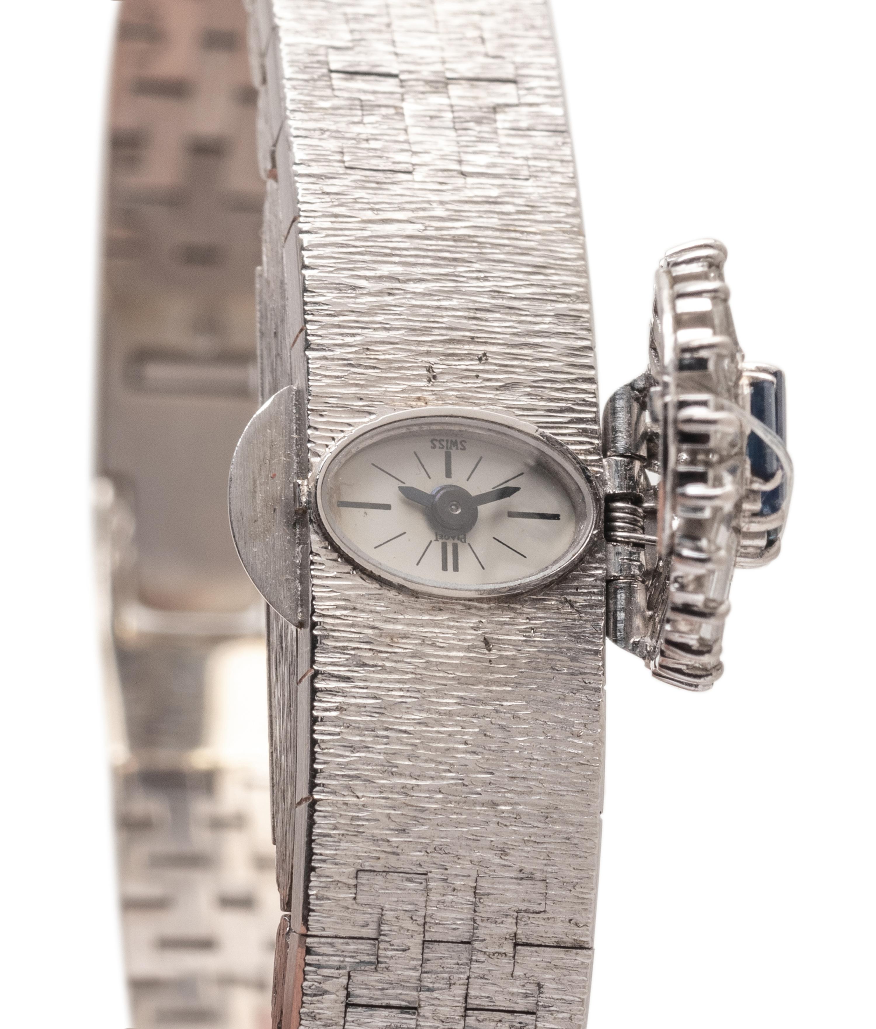 PIAGET, 18K WHITE GOLD, DIAMOND AND SAPPHIRE SURPRISE WATCH