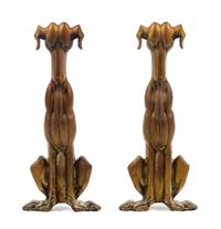 A Pair of Bronze Andirons depicting Stylized Dogs Height 18 inches.