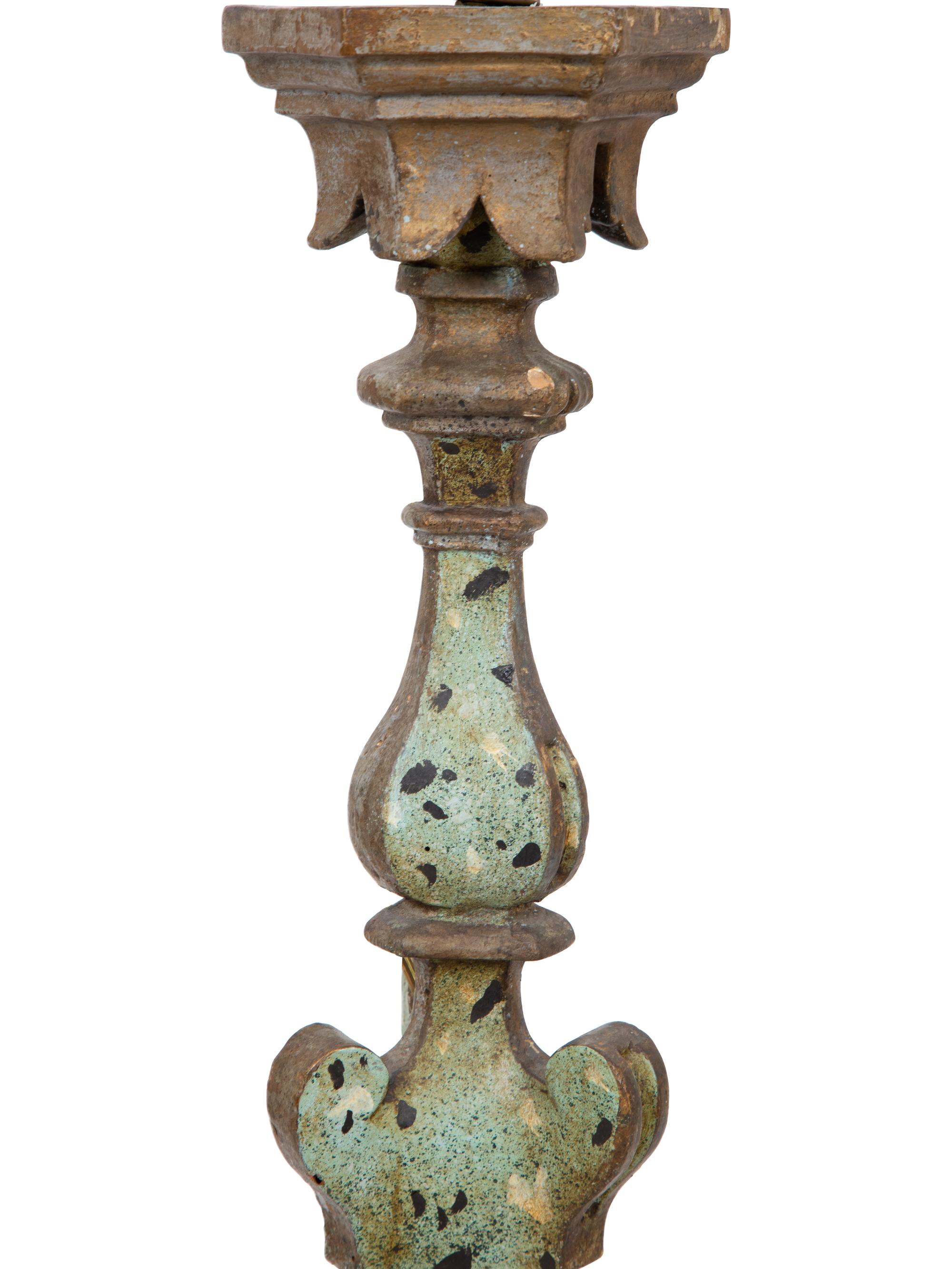 A Pair of Italian Painted and Parcel Gilt Pricket Candlesticks