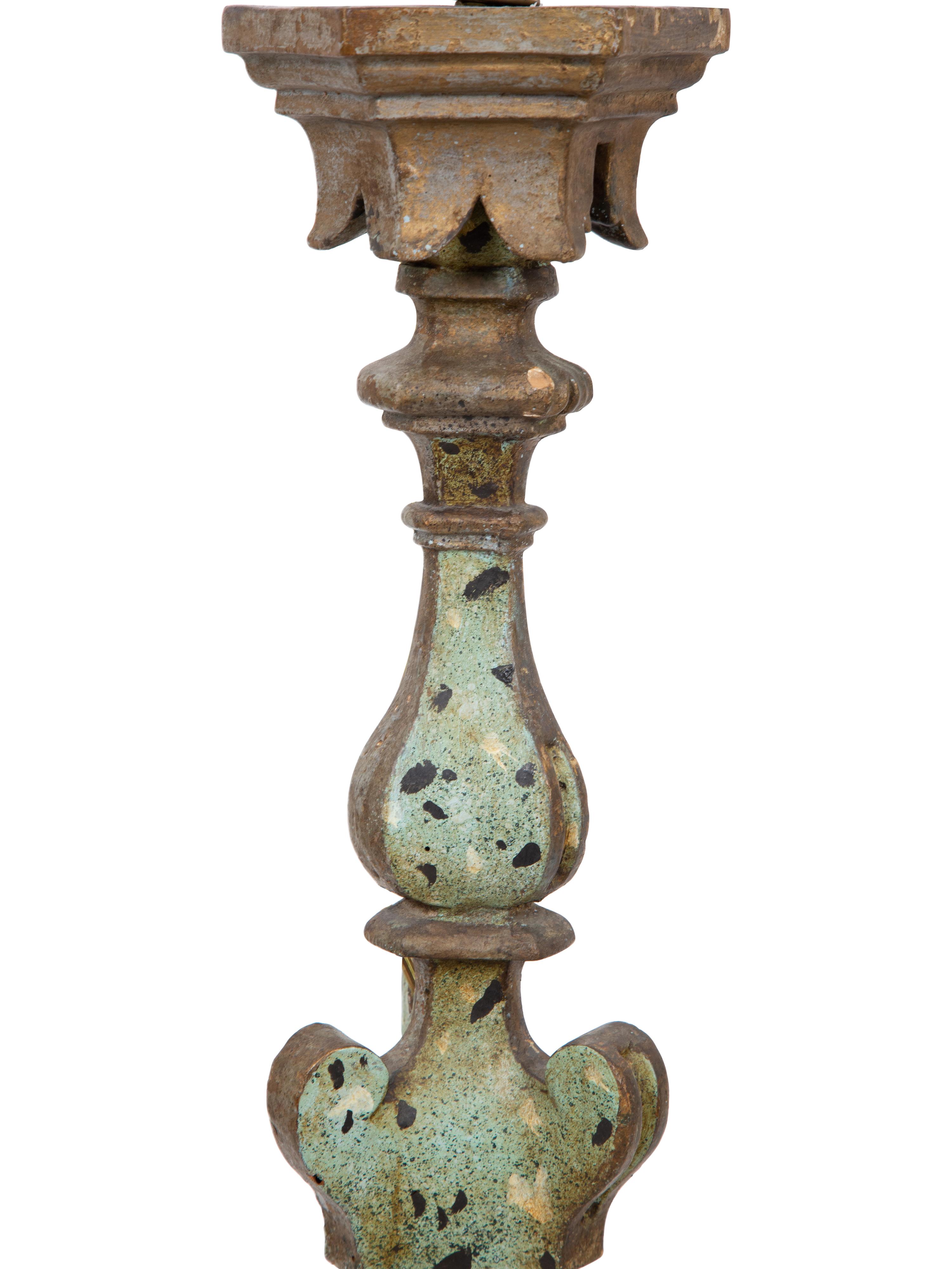 A Pair of Italian Painted and Parcel Gilt Pricket Candlesticks