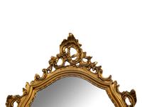 An Italian Baroque Style Giltwood Mirror