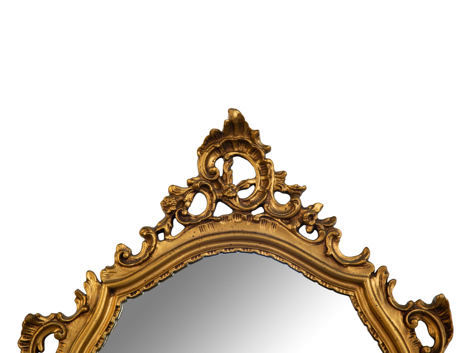 An Italian Baroque Style Giltwood Mirror