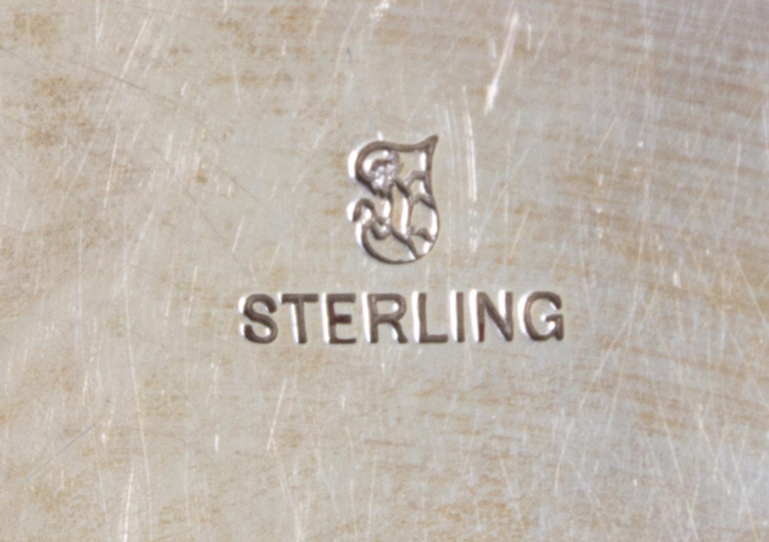 An American Silver Charger, Towle Silversmiths, Newburyport, MA, with raised EMW monogram.