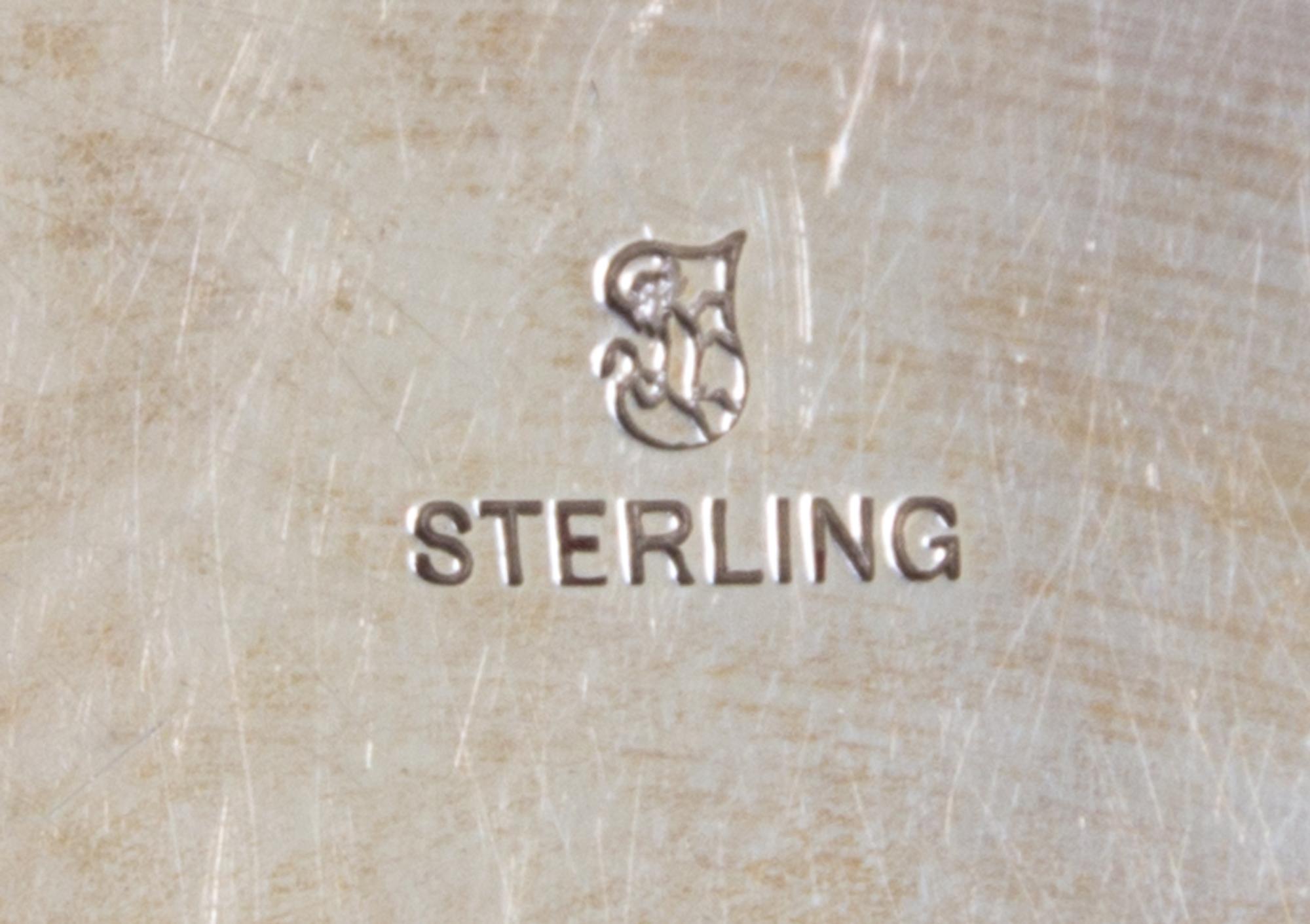 An American Silver Charger, Towle Silversmiths, Newburyport, MA, with raised EMW monogram.