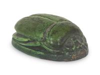 A Grueby Pottery Matte Green Scarab Paperweight