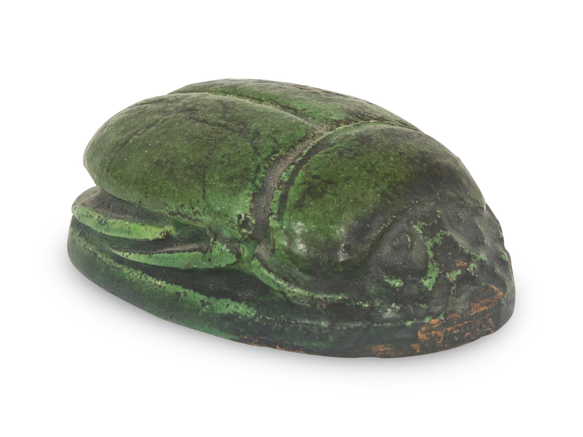 A Grueby Pottery Matte Green Scarab Paperweight
