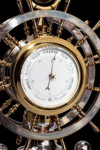 An English Steel and Brass Ship's Wheel Clock and Barometer, E&E Emanuel