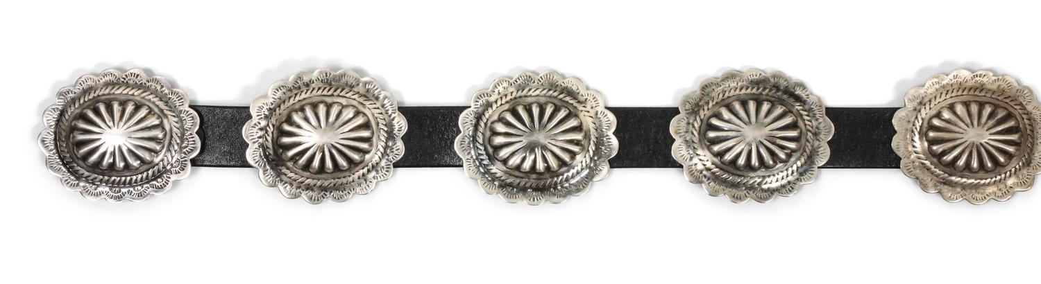 A Navajo Concho Belt Length 45 inches, height of buckle 2 14/ x width 2 3/4 inches.