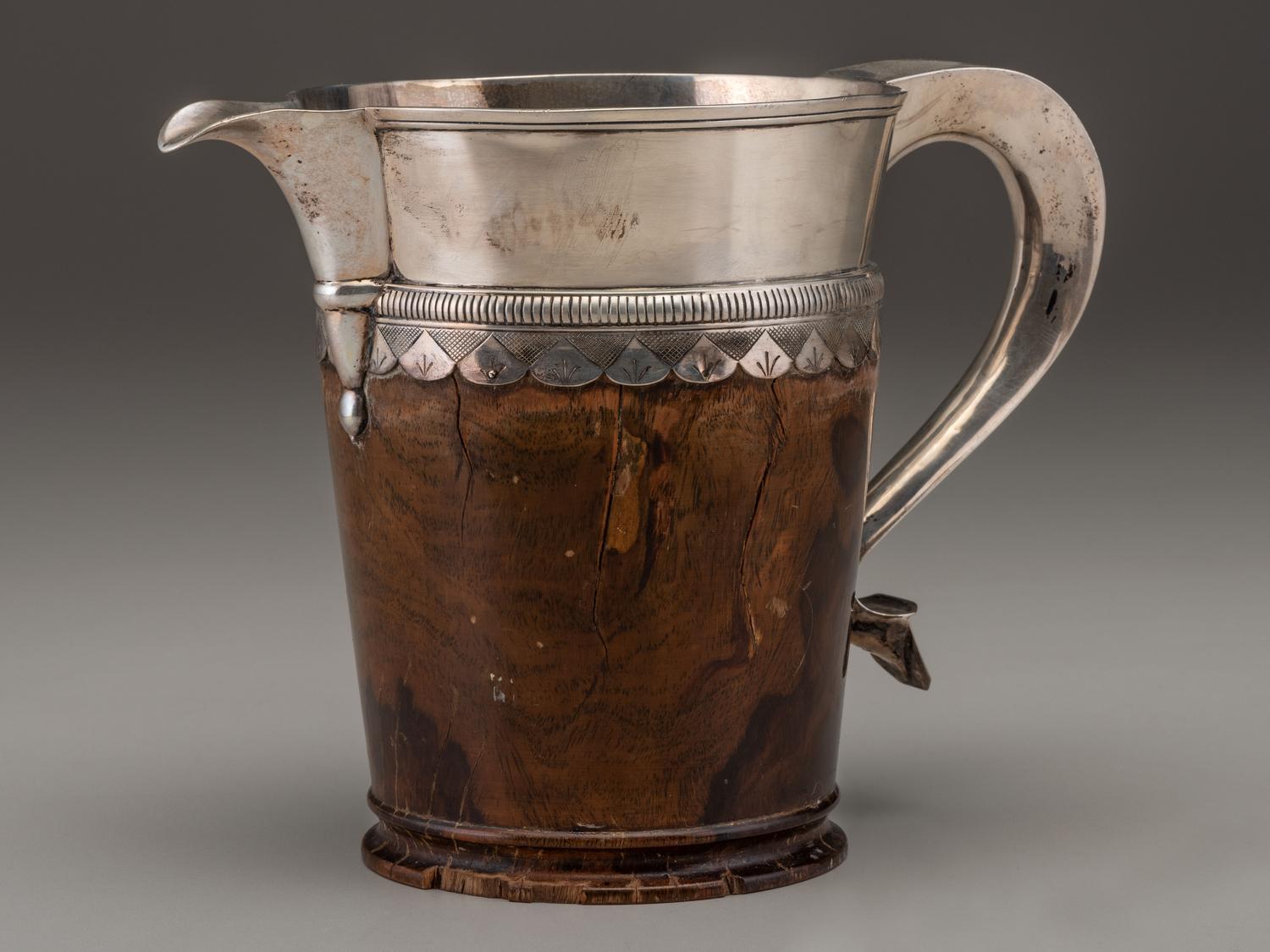 A Silver Mounted Mahogany Pitcher and Six Cups
