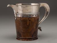 A Silver Mounted Mahogany Pitcher and Six Cups