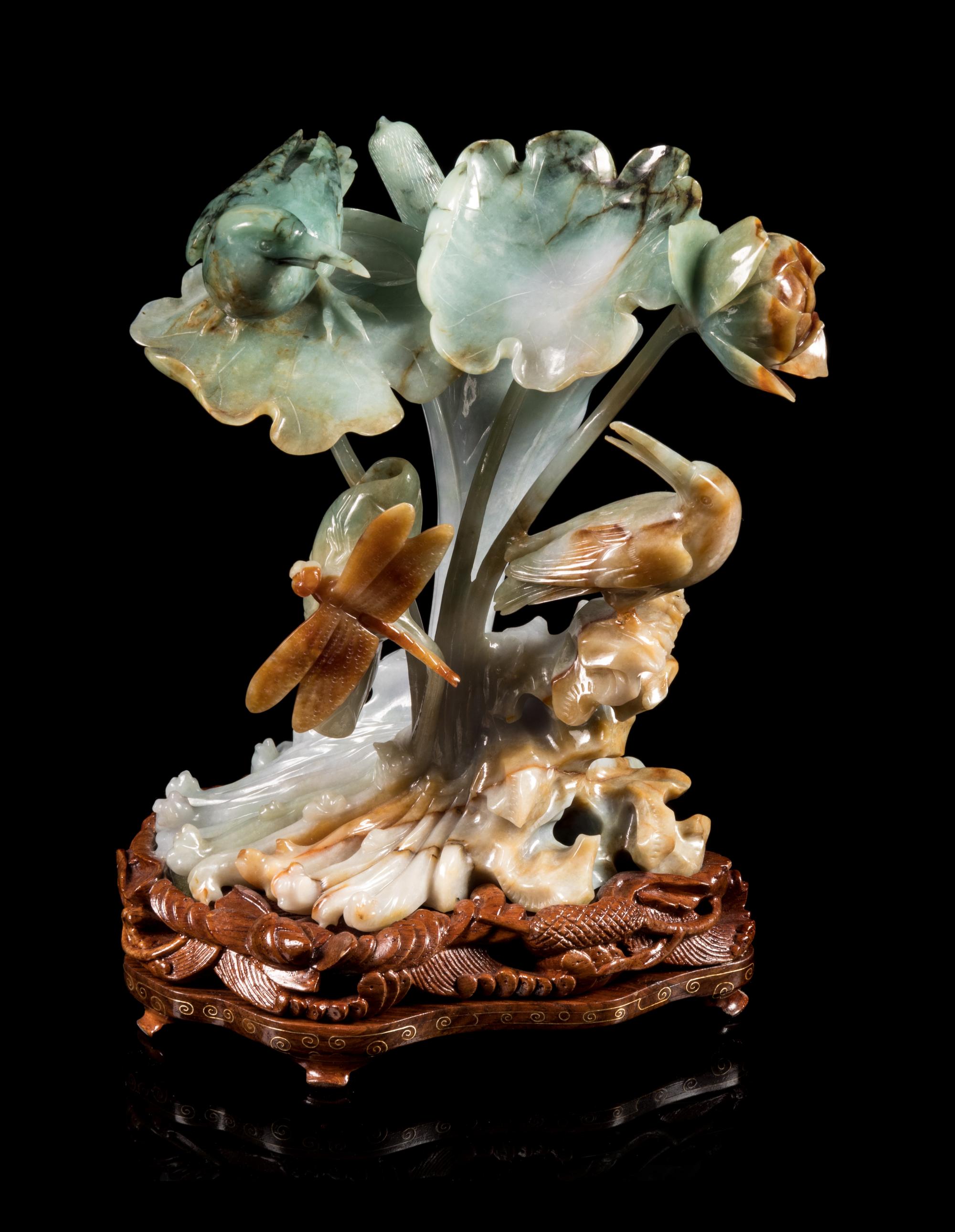 A Green, Russet and Pale Celadon Jadeite Figural Group of Bird, Dragonfly and Lotus Height 6 3/4 inches. — 20TH CENTURY