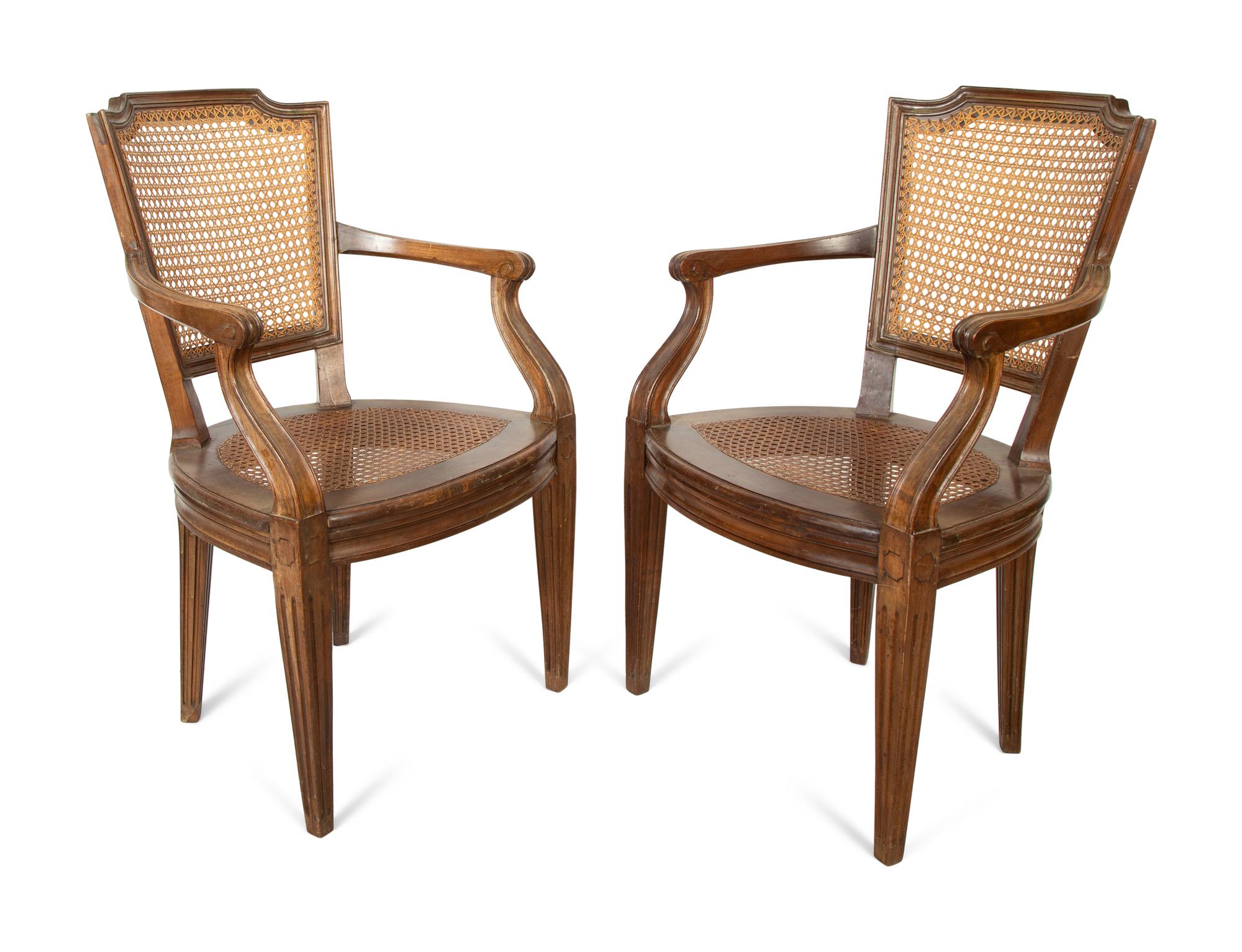 A Pair of Italian Caned Armchairs