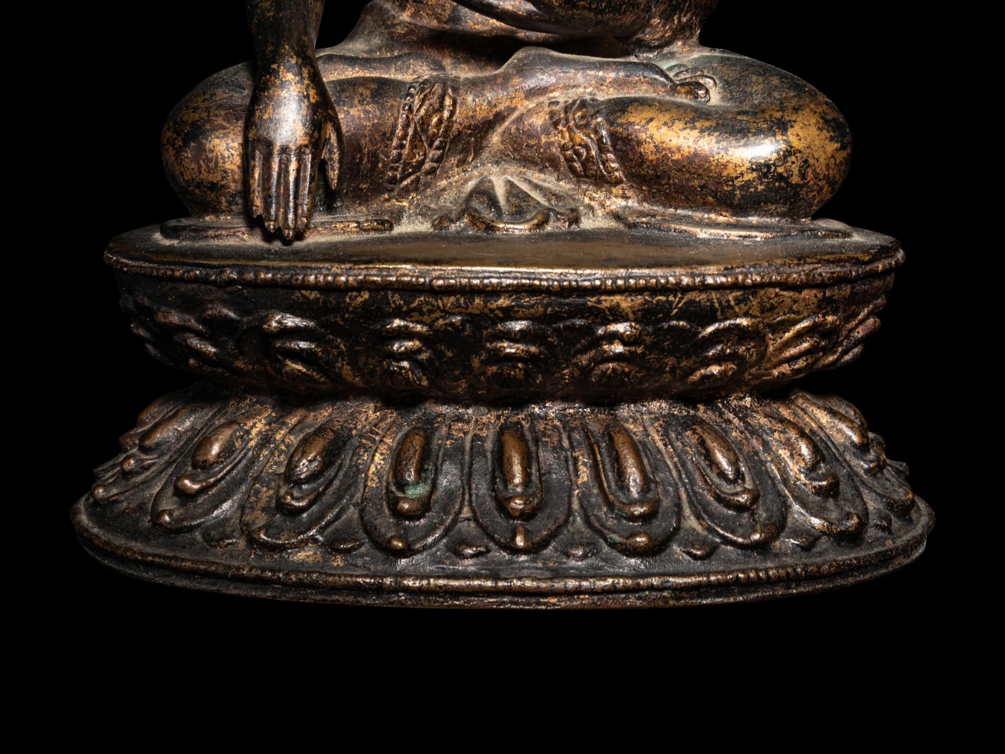 A Large Nepalese Gilt Bronze Figure of Seated Buddha
