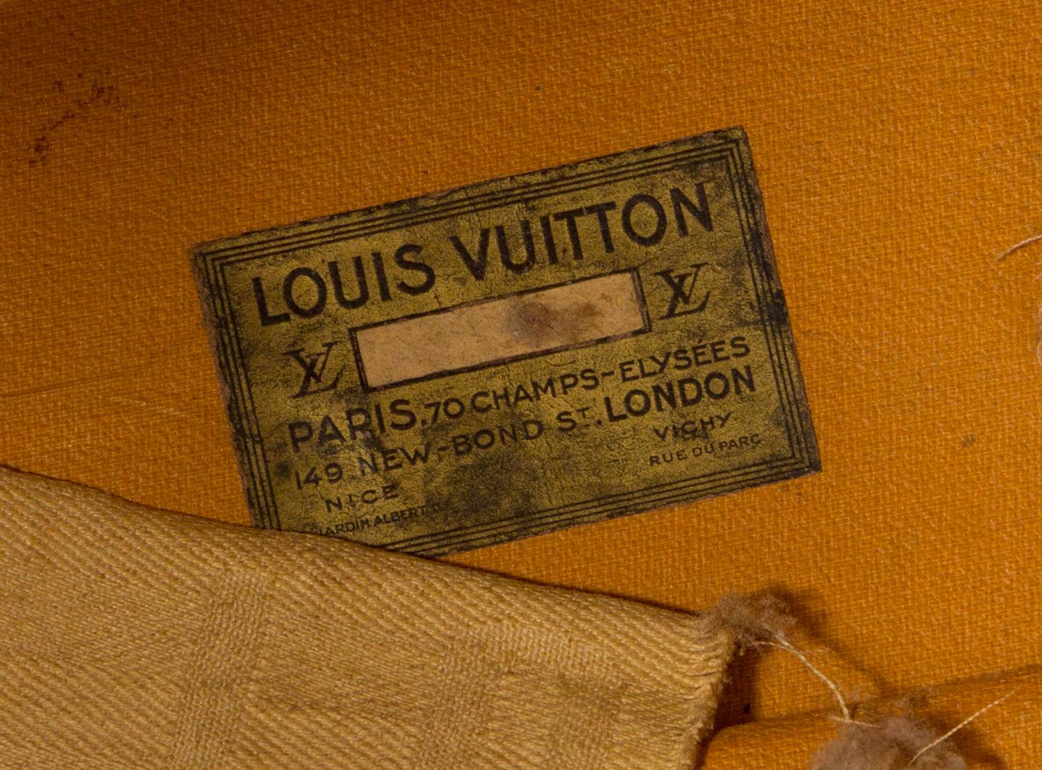 A Louis Vuitton Monogram Leather Wardrobe Trunk, 33.5"H x 21.25"W x 9"D.
