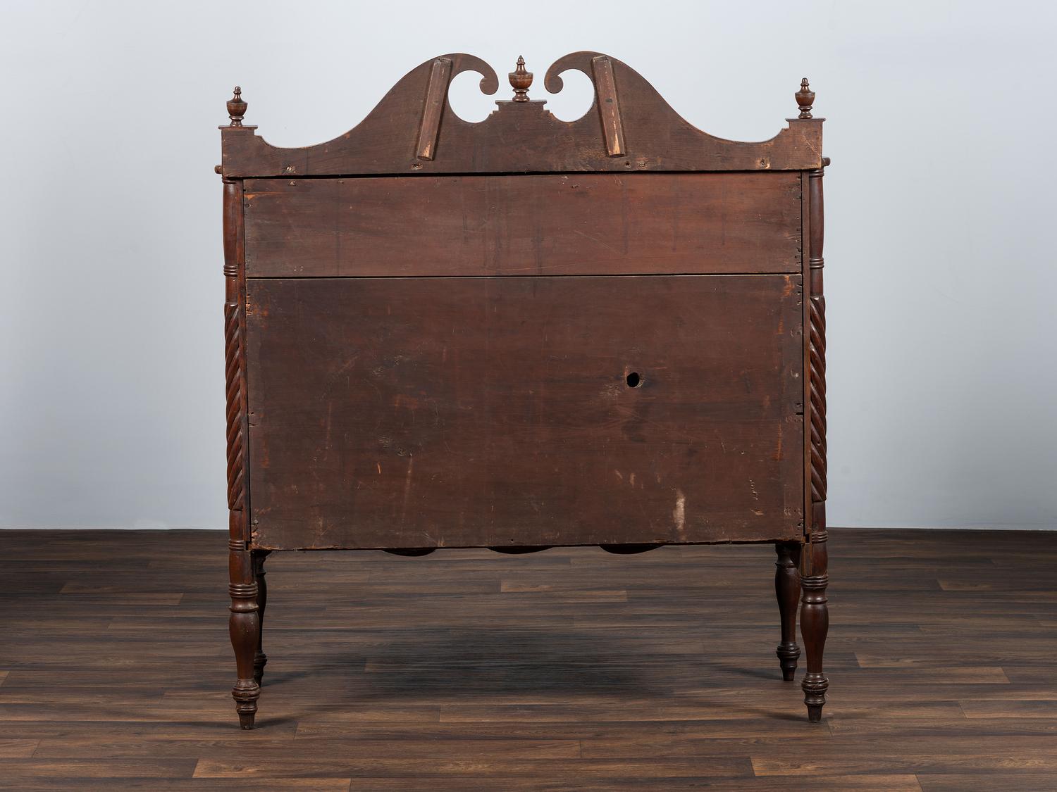 A Late Federal Spiral-Twist Carved and Figured Mahogany Chest of Drawers