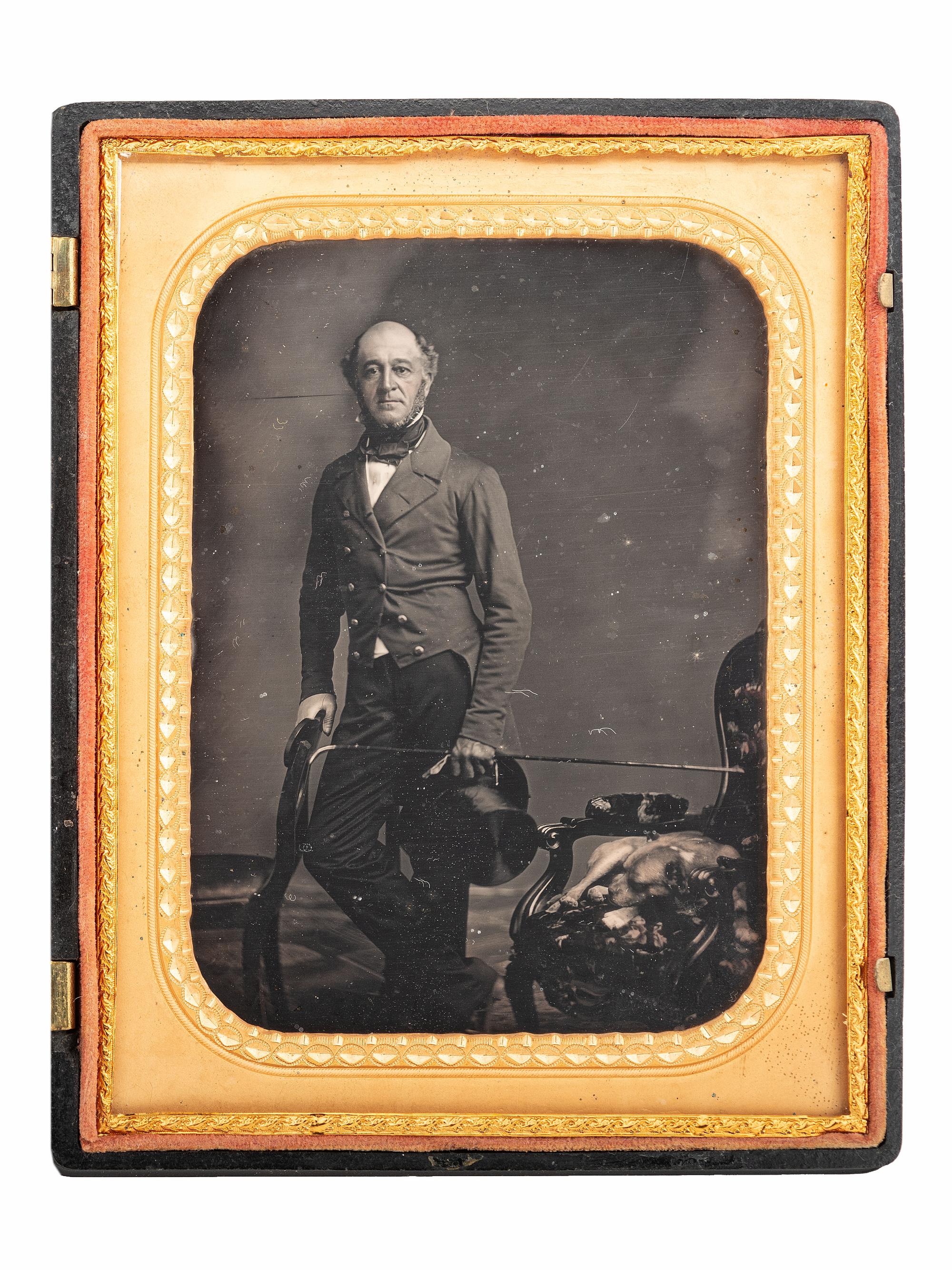 [EARLY PHOTOGRAPHY]. Half plate daguerreotype featuring a gentleman and his sleeping canine companion.