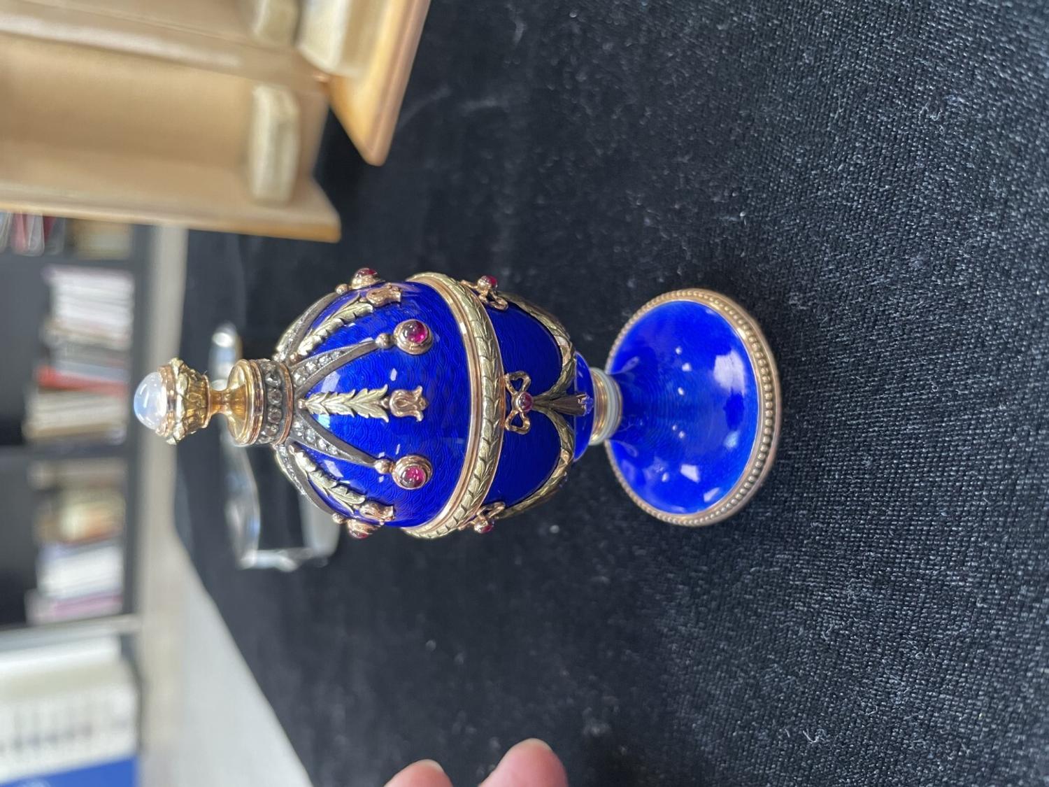 A 14 Karat Vari-Color Gold, Guilloché Enamel, Diamond, and Cabochon Jewel-Mounted Egg-Form Perfume and a Related Guilloché Enamel, 14 Karat Vari-Color Gold, Diamond, and Cabochon-Mounted Surprise Egg