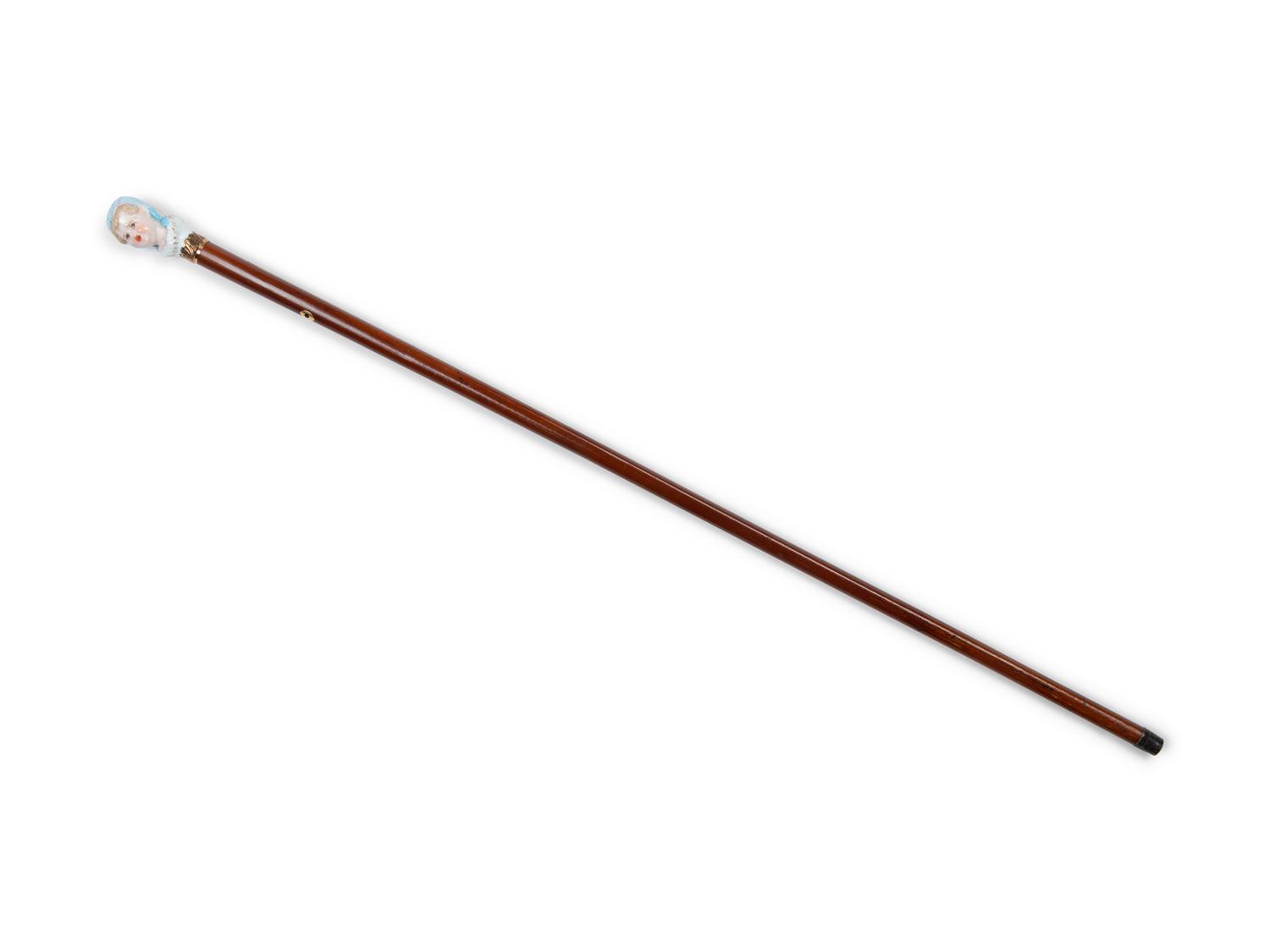 A French Figural Porcelain and Gilt Metal Mounted Cane