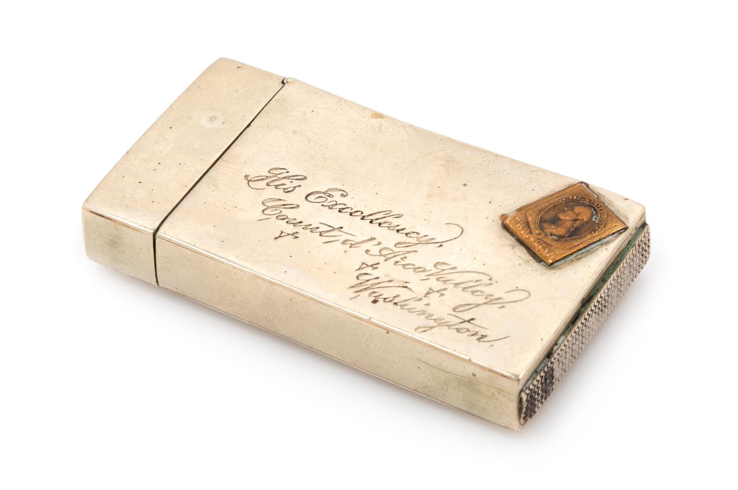 An American Silver Match Safe, Late 19th/Early 20th Century, in the form of a stamped envelope.