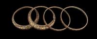 A Group of Four Chinese Gold and Silver Inlaid Bronze Fittings from Hu Vessels