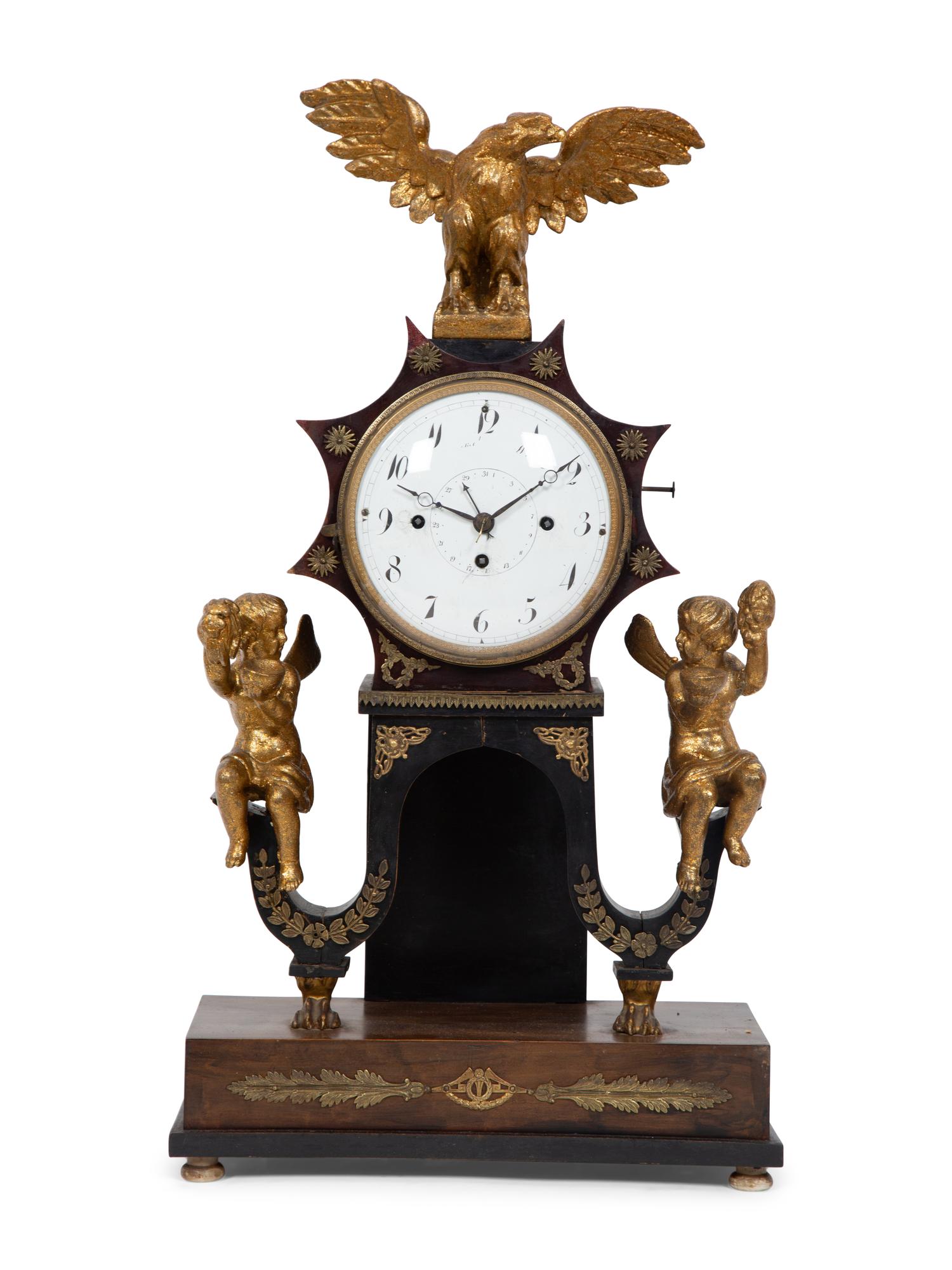 An Austrian Ebonized and Burlwood Mantel Clock with Gilt Metal and Giltwood Mounts
