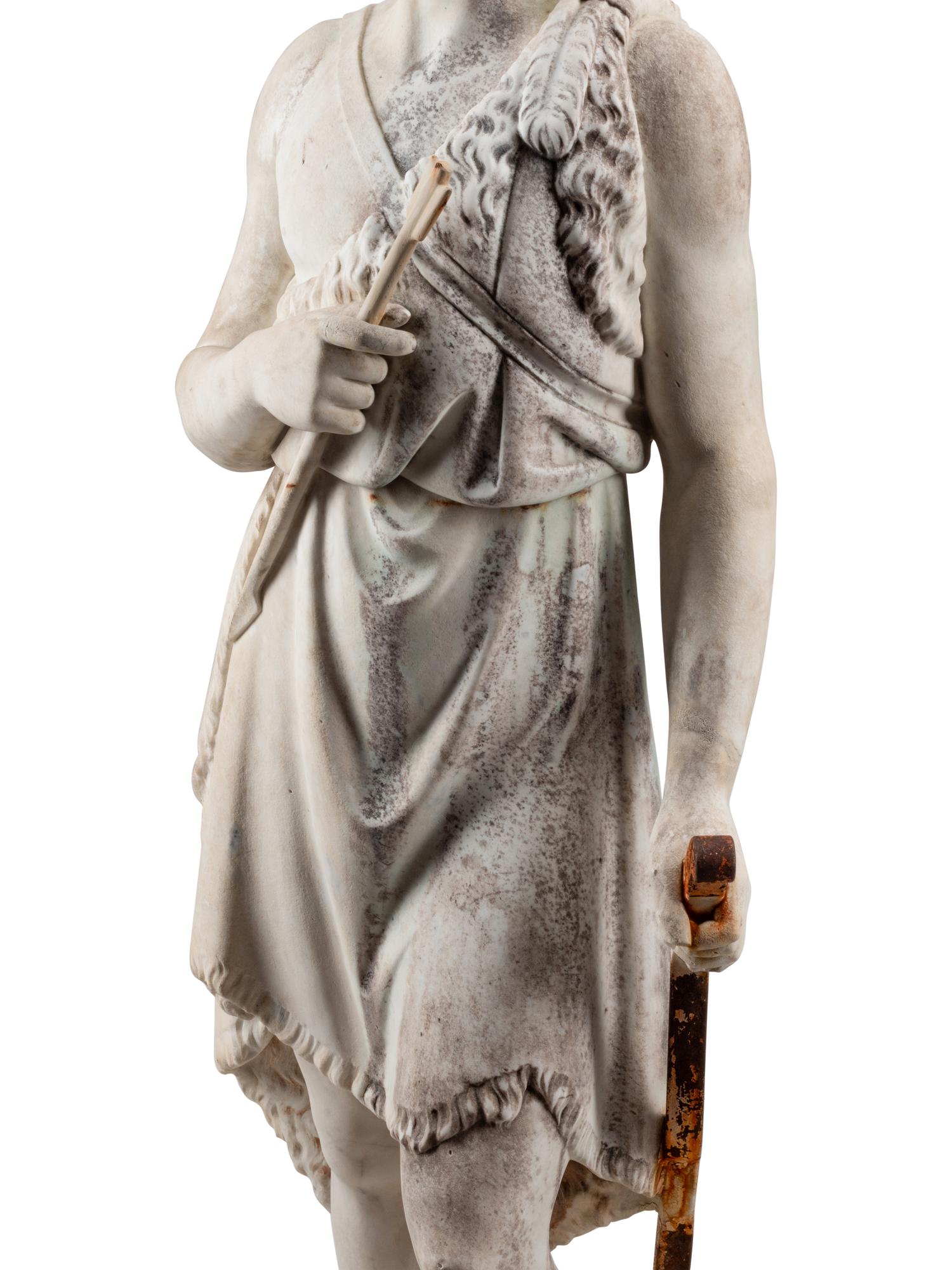 A Continental Marble and Iron Figure of an Archer with a Boar’s Head