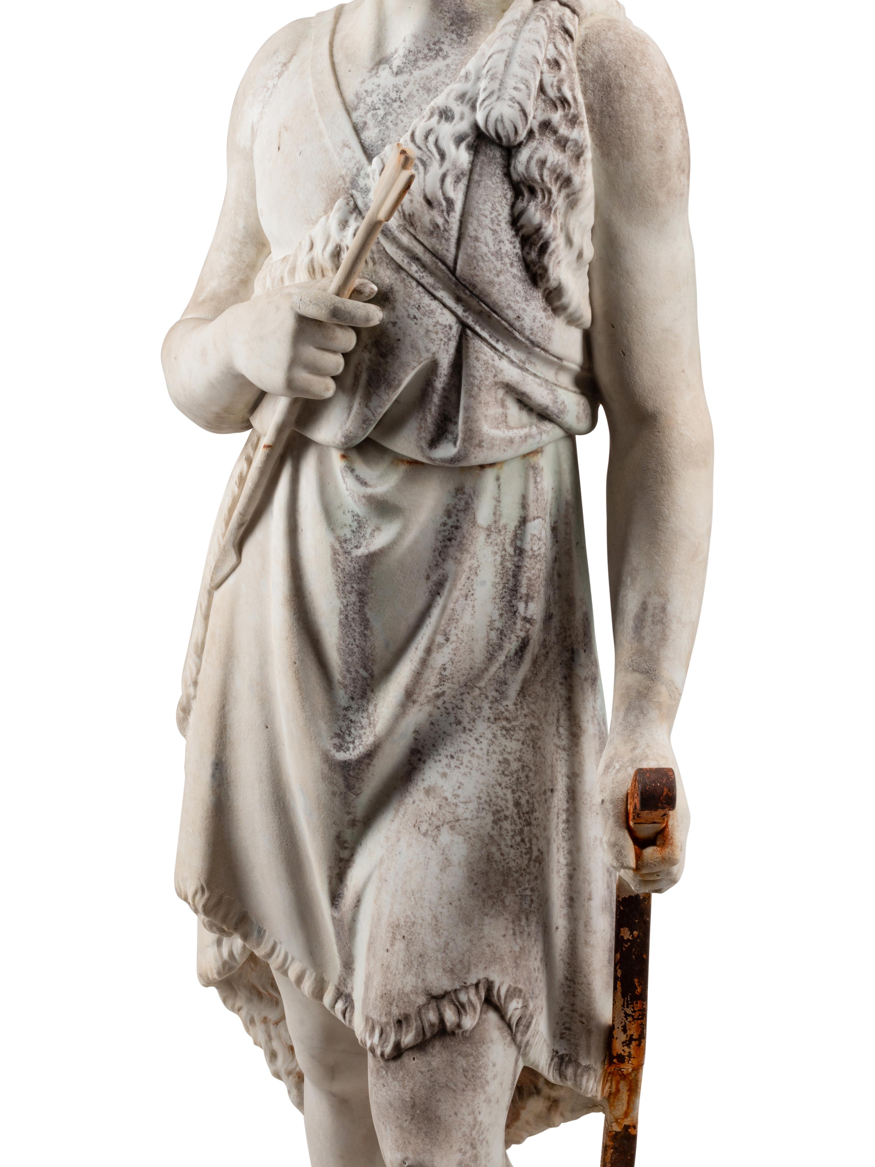 A Continental Marble and Iron Figure of an Archer with a Boar’s Head