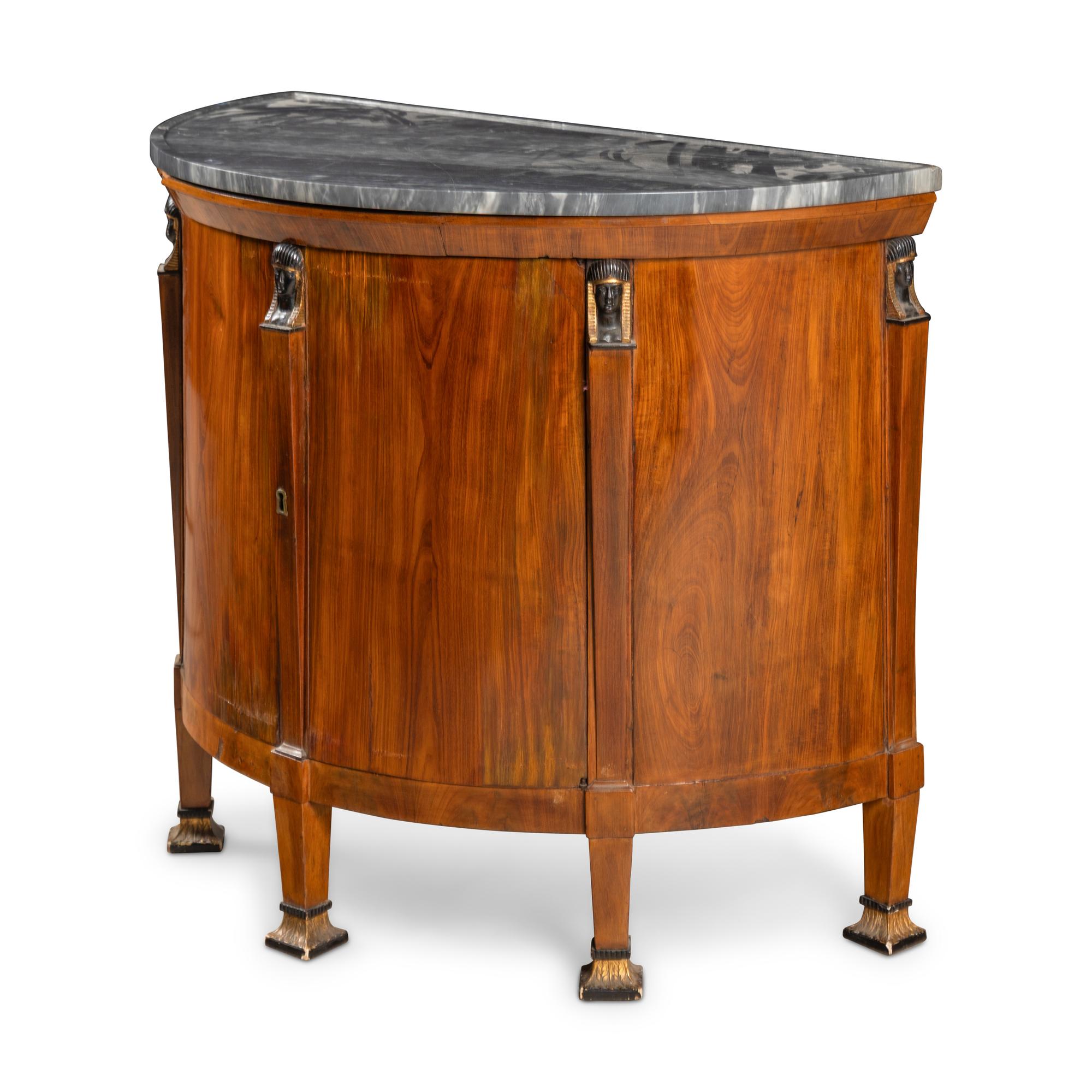 A German or Austrian Fruitwood, Part Ebonized and Parcel Gilt Marble Top Cabinet