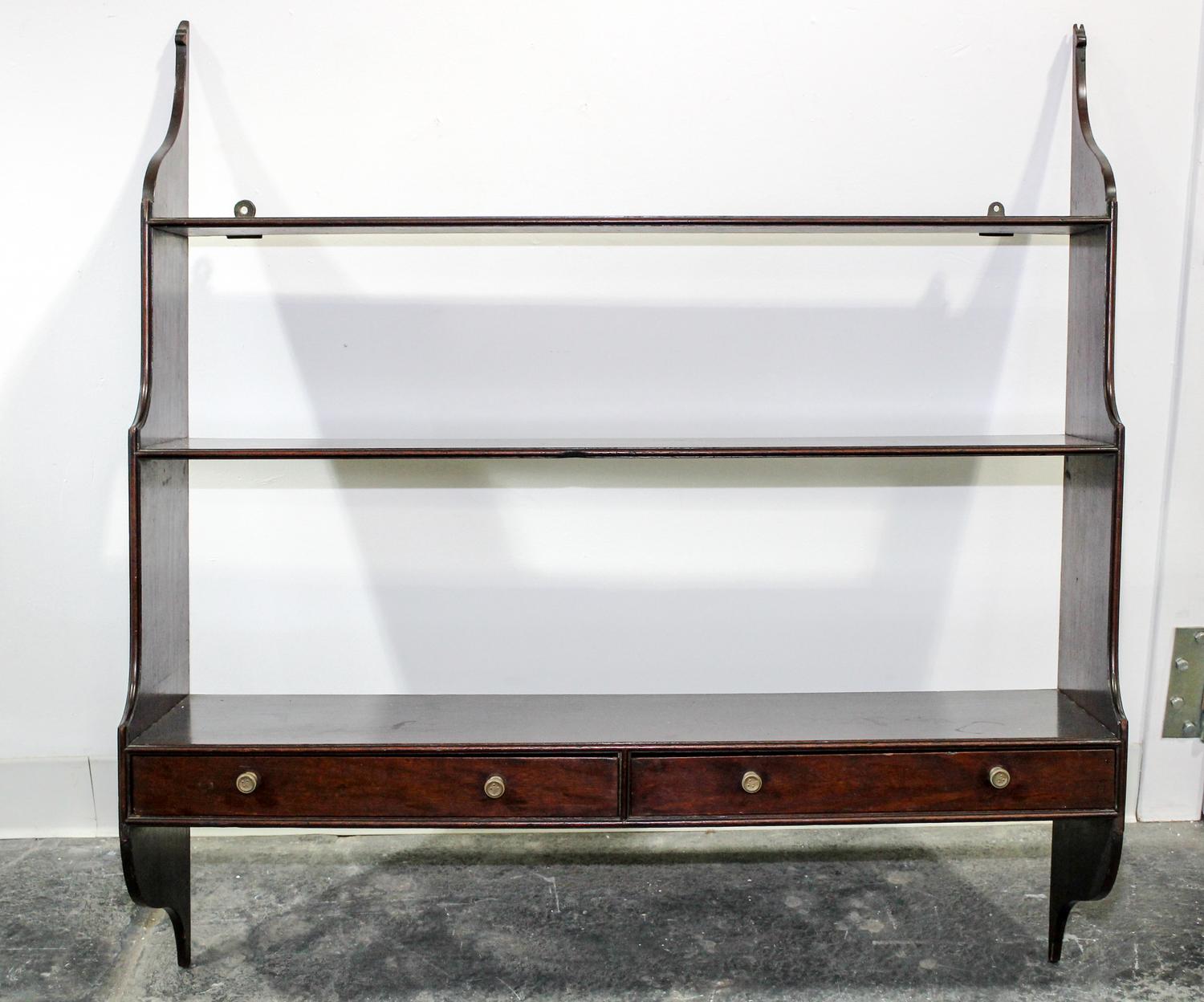 An English Mahogany Hanging Étagère Width 36 inches. — 20TH CENTURY