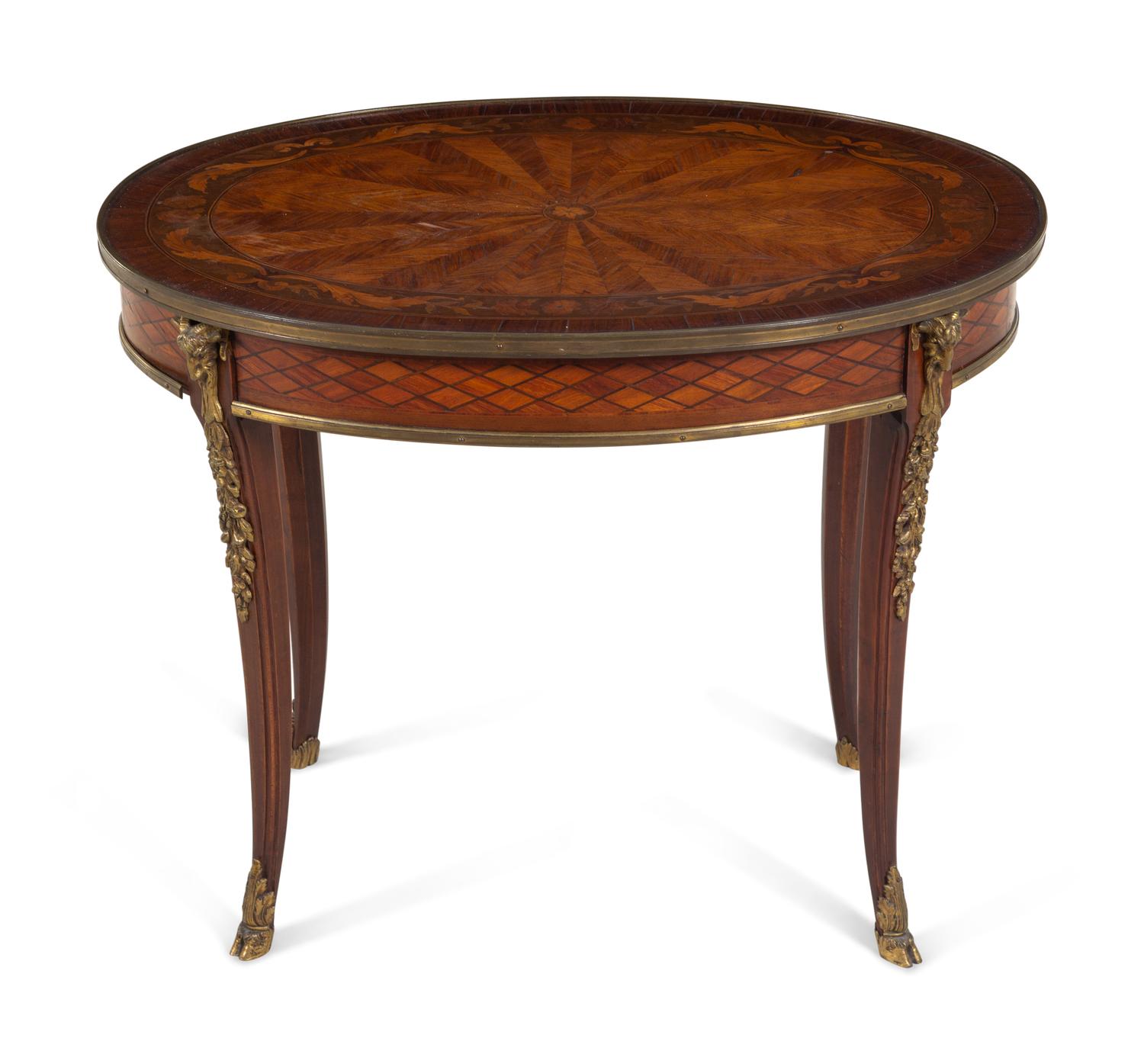 A Continental Marquetry and Gilt Metal Mounted Low Table