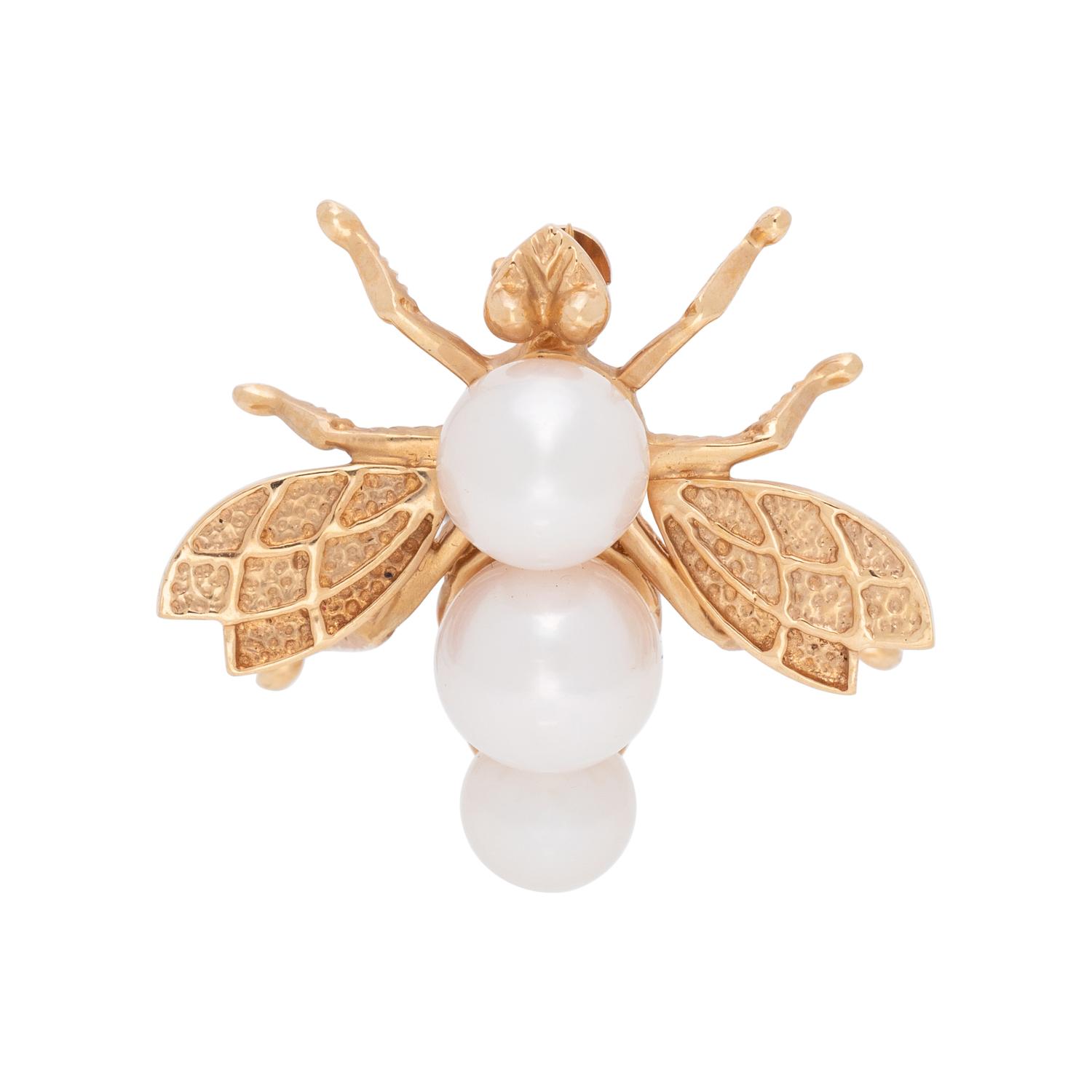 COLLECTION OF YELLOW GOLD BROOCHES