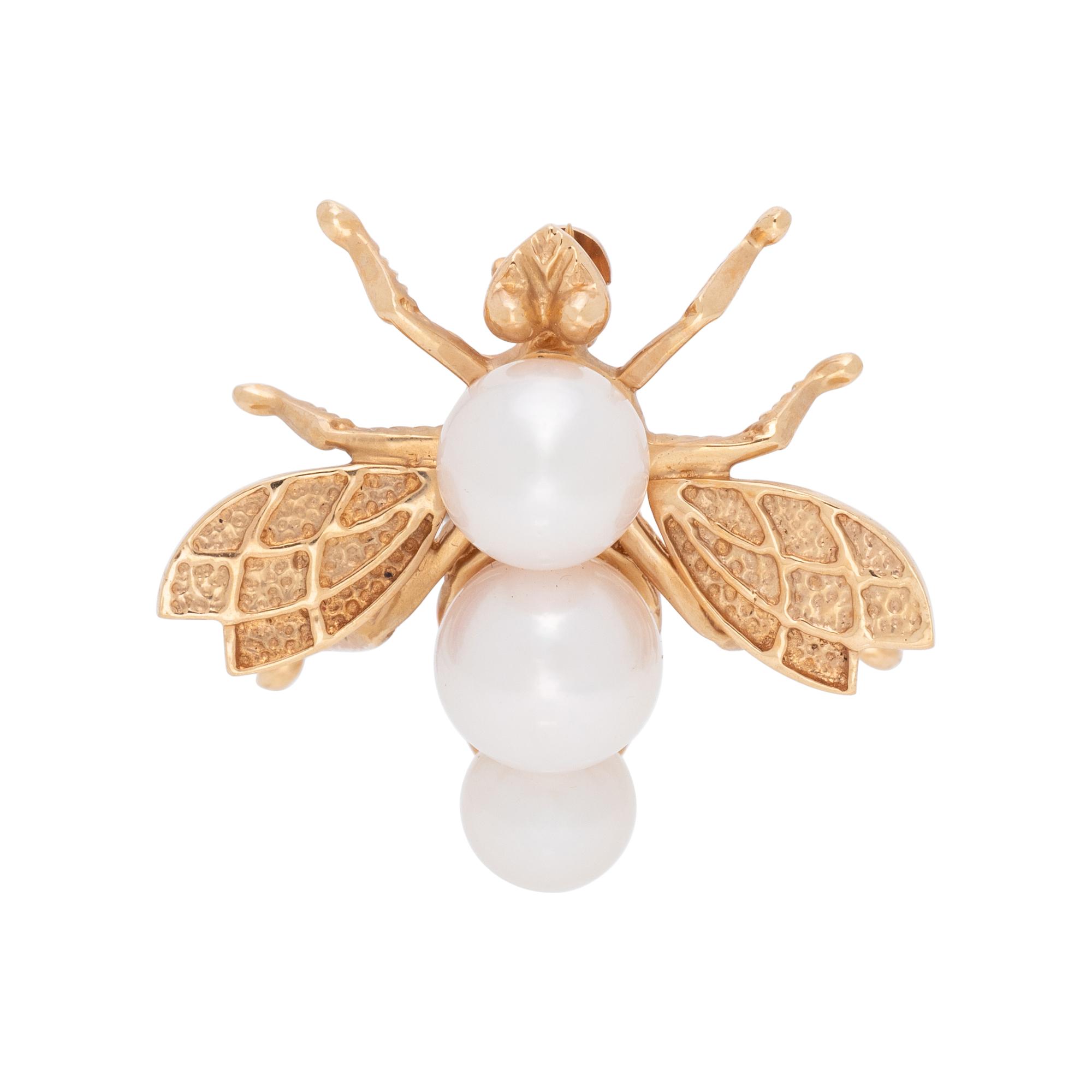 COLLECTION OF YELLOW GOLD BROOCHES