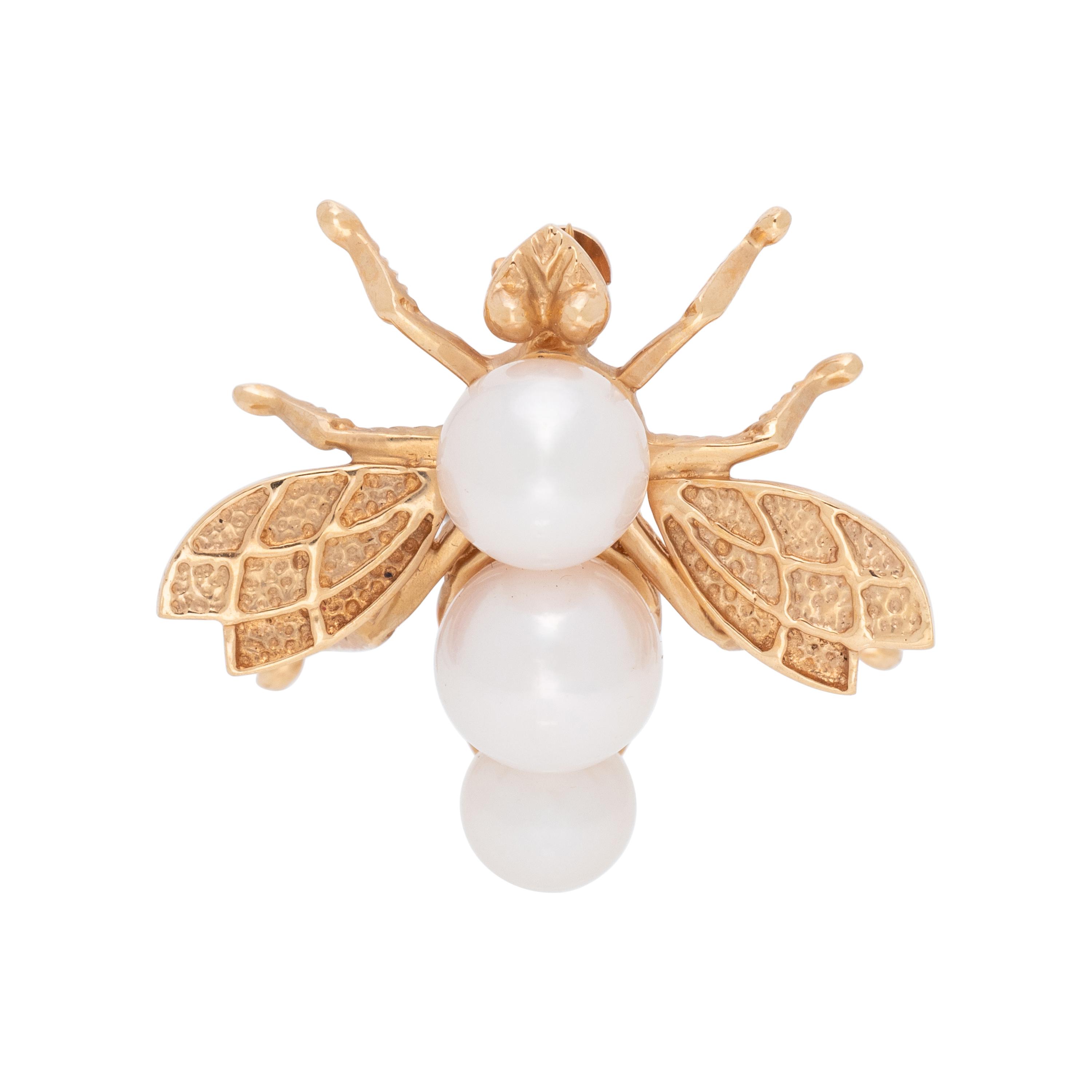COLLECTION OF YELLOW GOLD BROOCHES