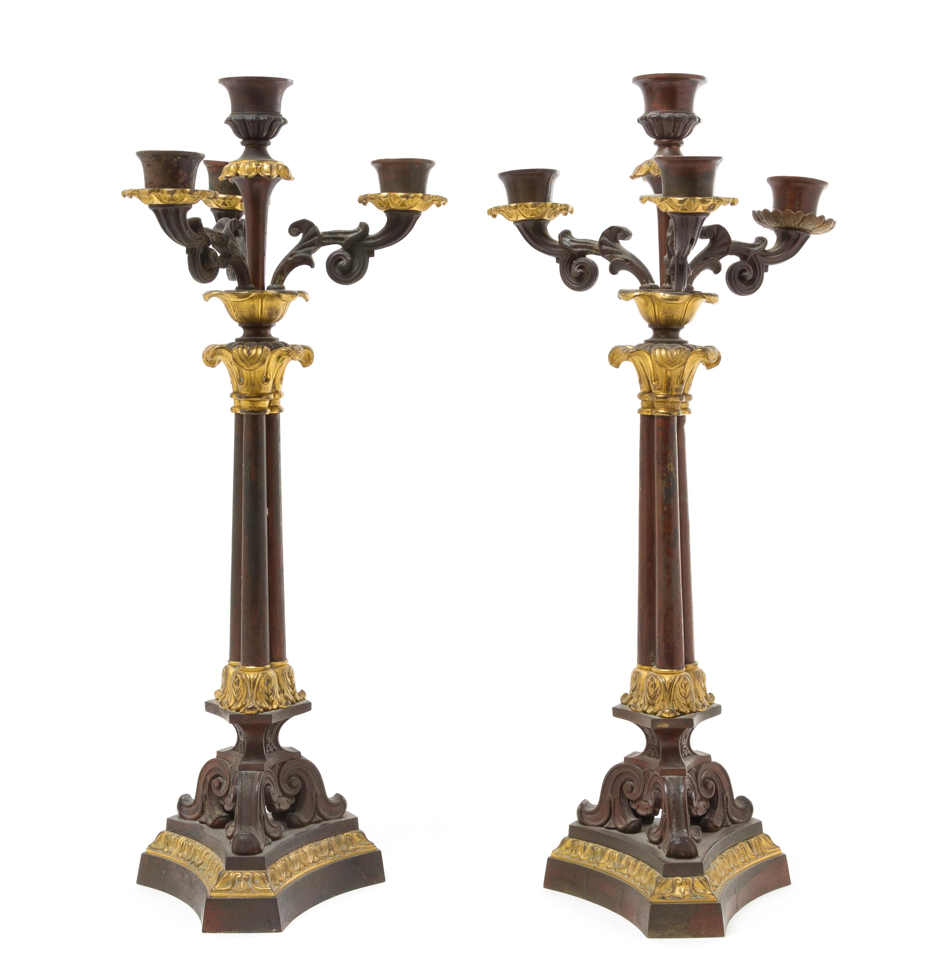 A Pair of Empire Style Gilt and Patinated Metal Four-Light Candelabra Height 16 5/8 inches.