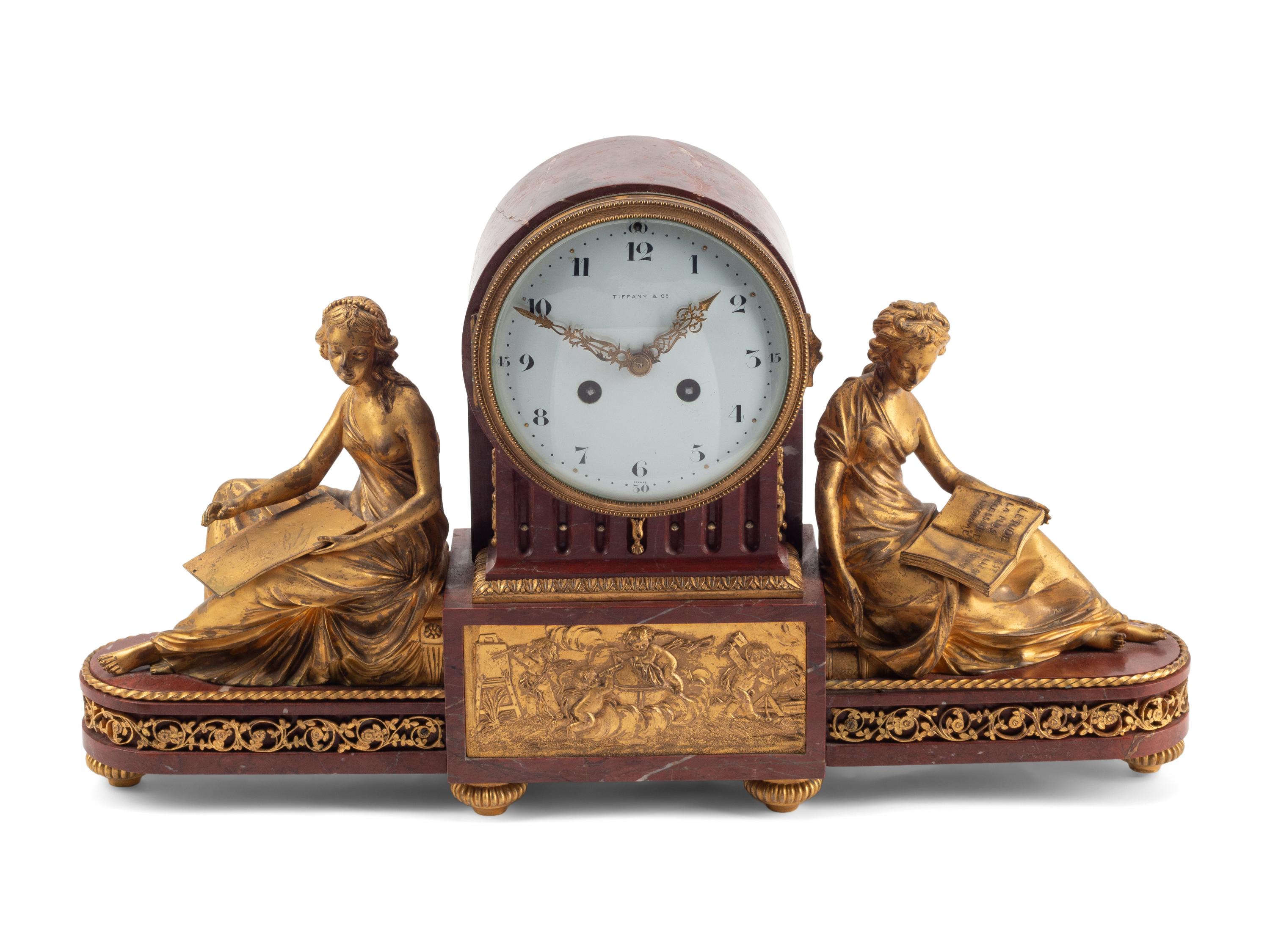 A Louis XVI Style Gilt Bronze and Rouge Griotte Marble Mantel Clock