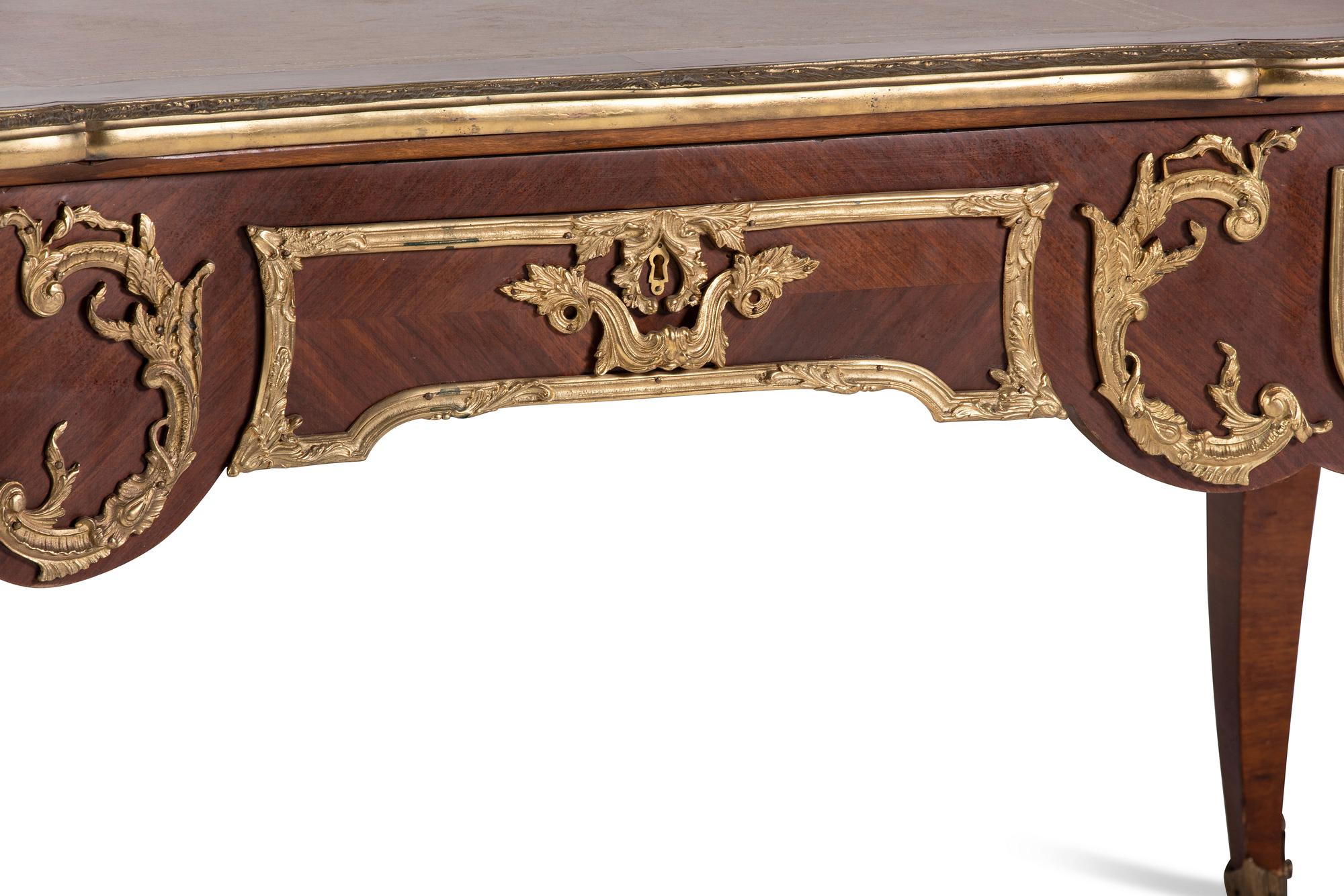 A Louis XV Style Gilt Bronze Mounted Mahogany Bureau Plat